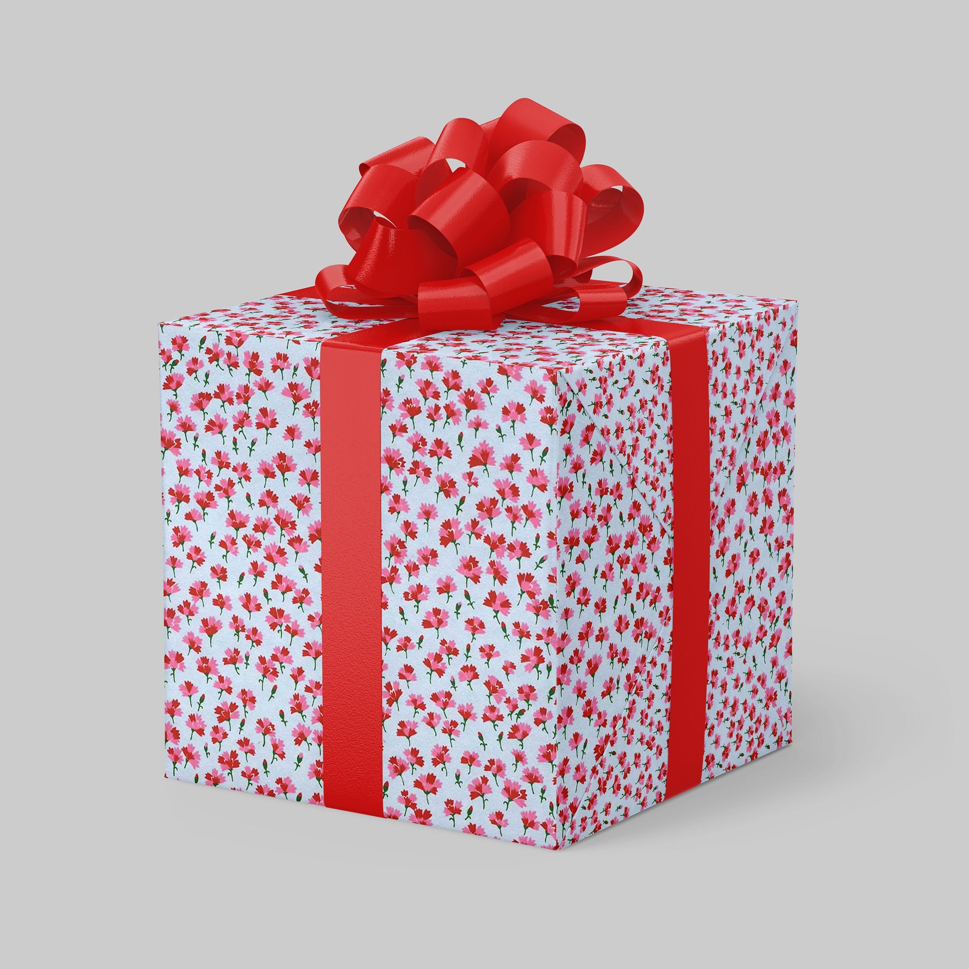 Gift box with floral pattern and red ribbon on a gray background