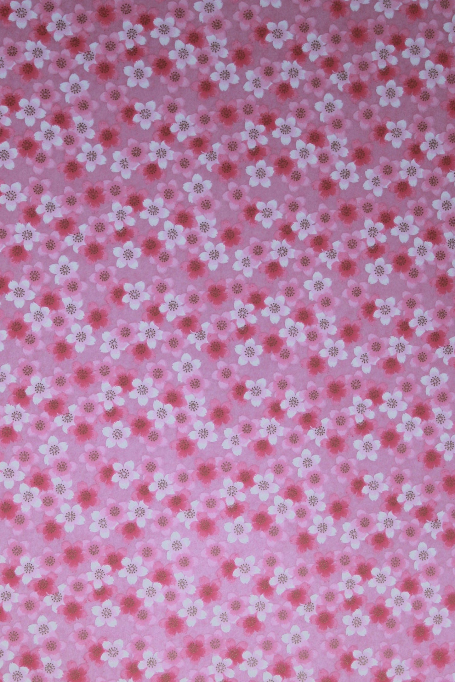Pink chiyogami paper with small white floral pattern