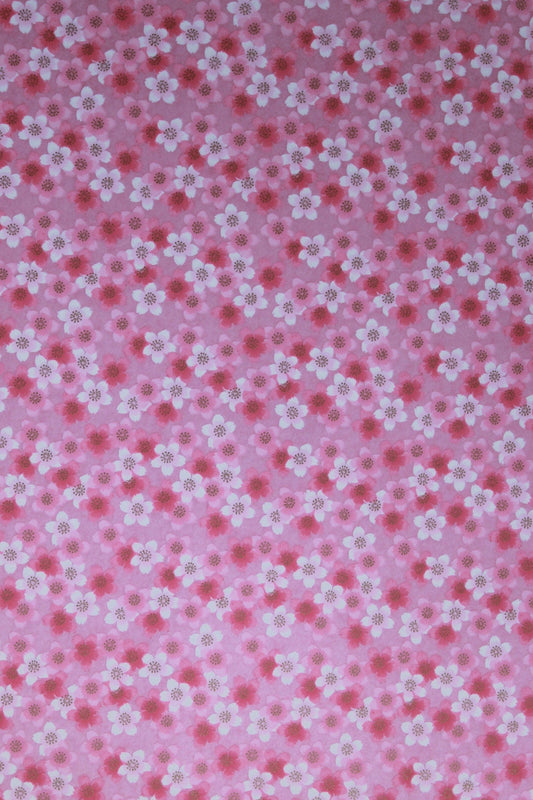 Pink chiyogami paper with small white floral pattern