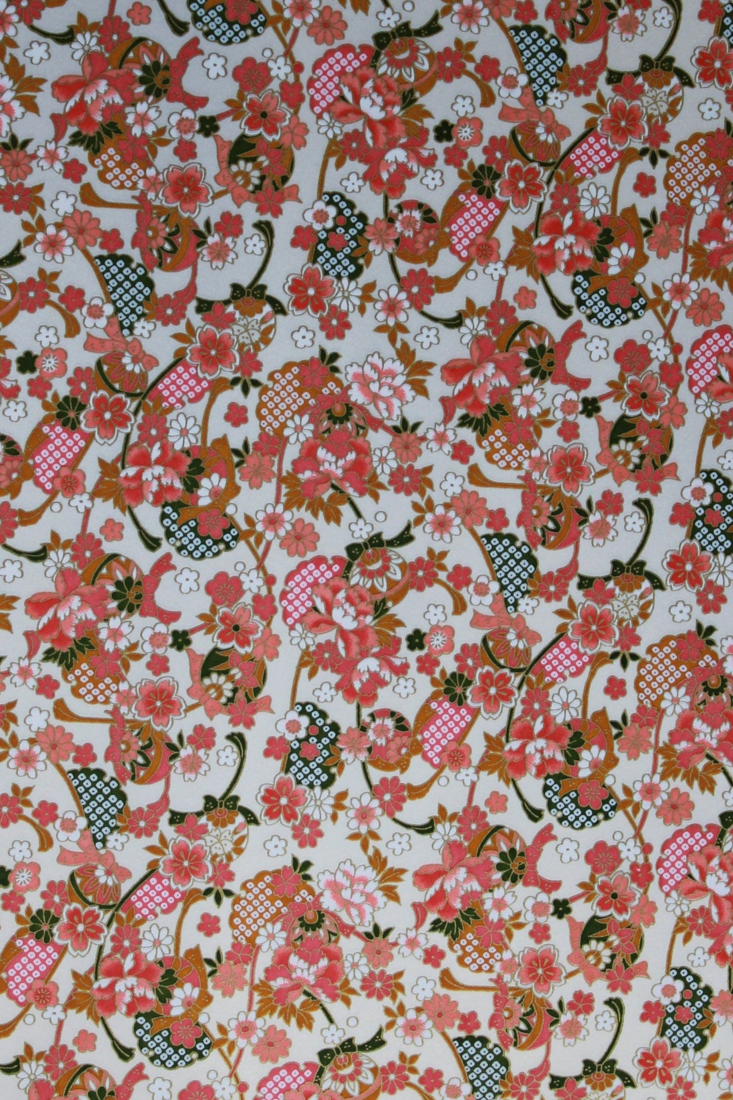 Floral patterned  chiyogami paper with pink, red, and green colors on a white background