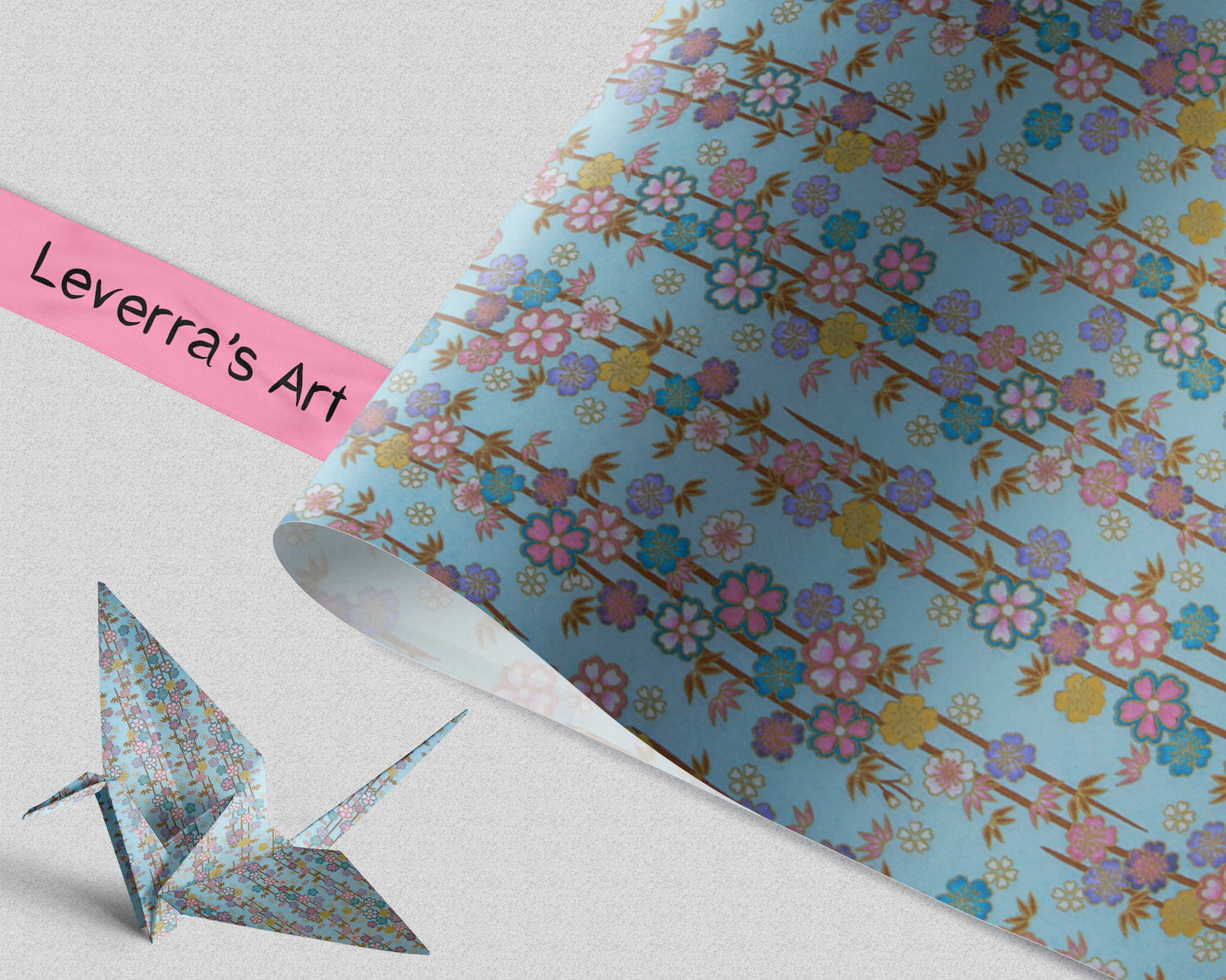 Floral-patterned chiyogami paper with an origami crane on a light gray background, featuring 'Leverra's Art' branding.