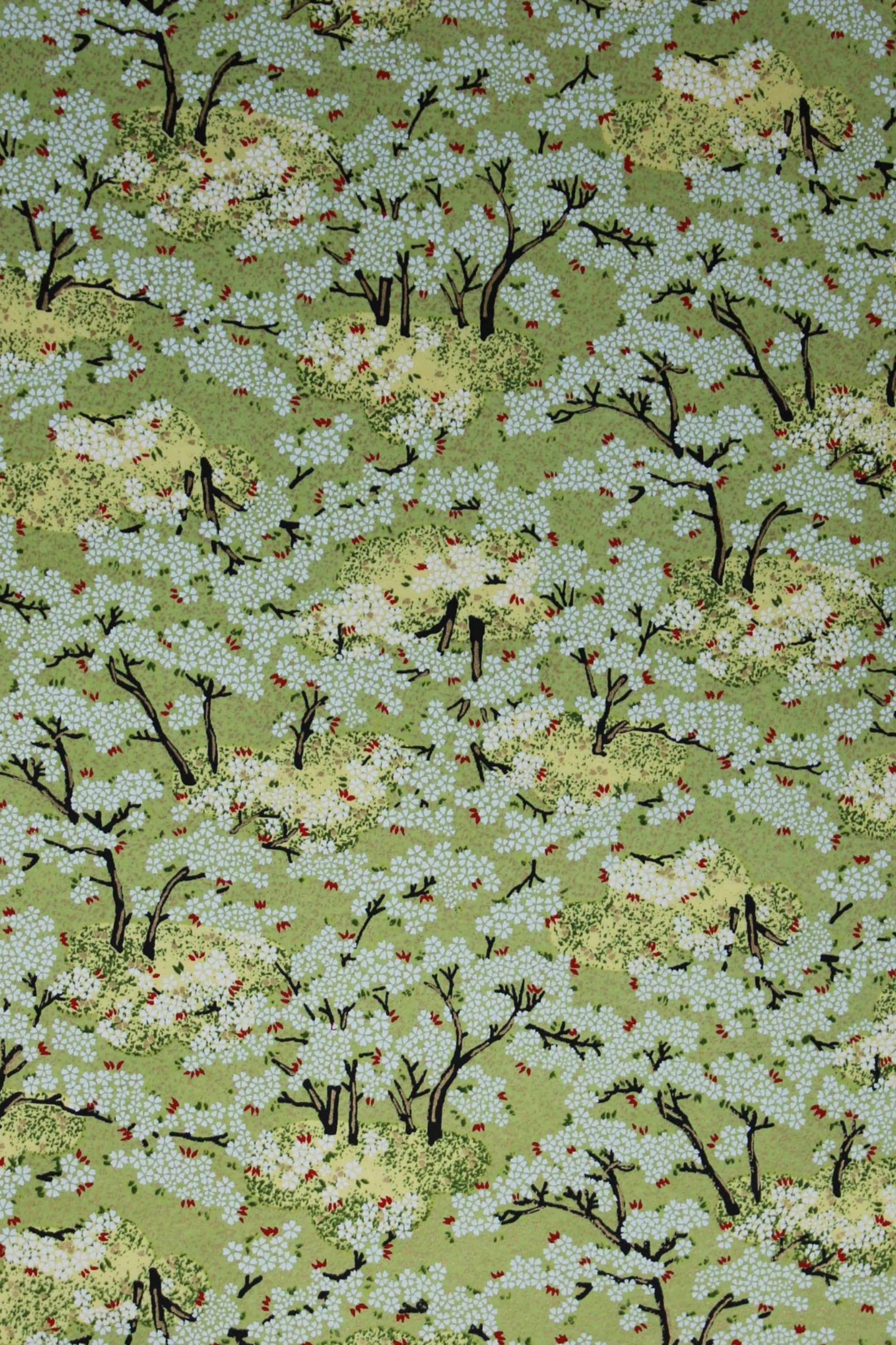 Textured green fabric with black and white patterns