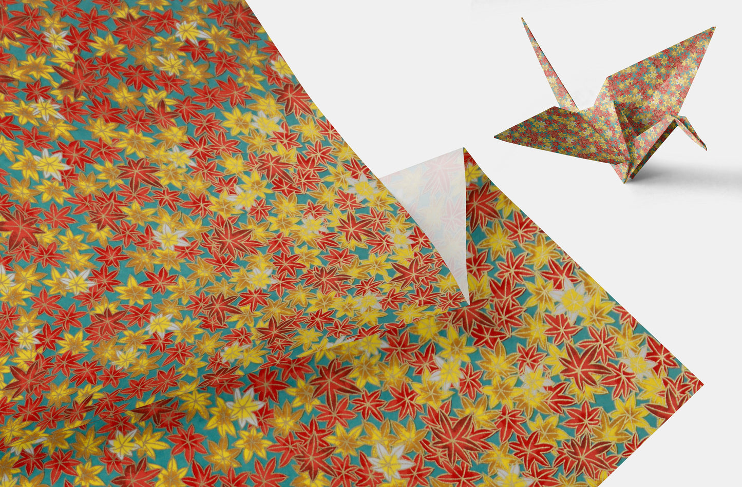 Colorful star-patterned paper with an origami crane on a white background