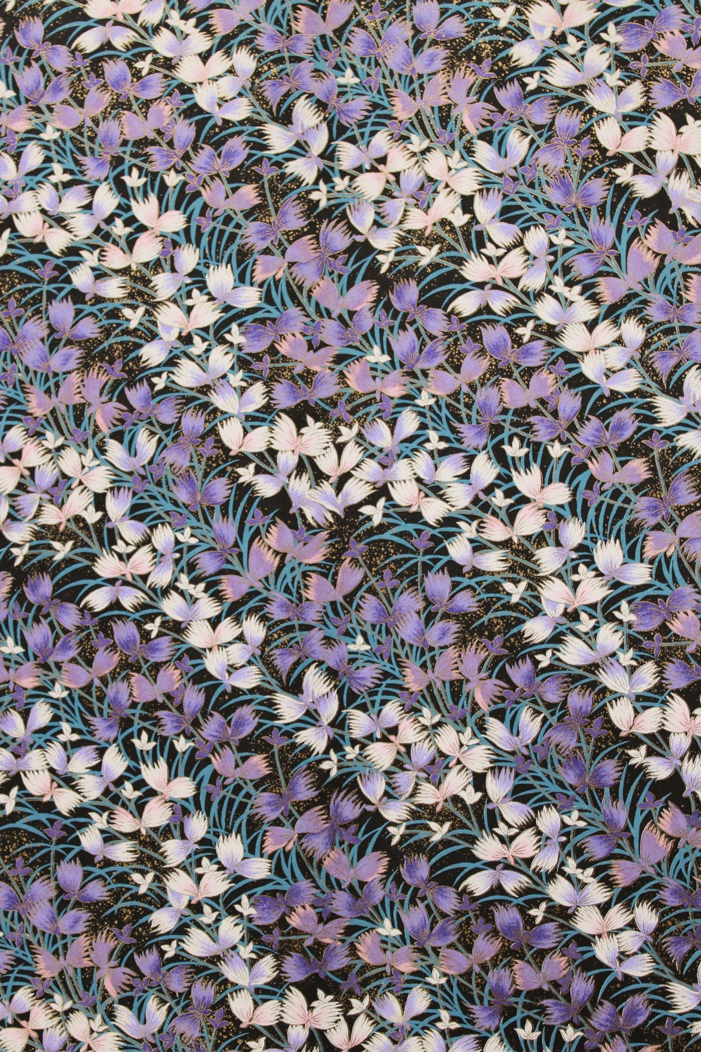 Pattern of small purple and white flowers on a fabric background
