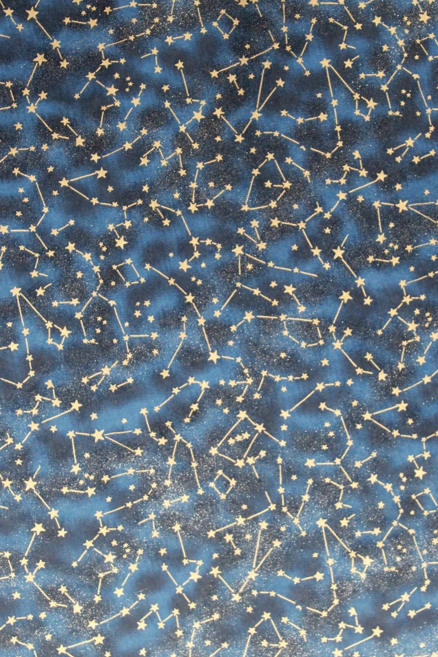 Pattern of stars and constellations on a blue background