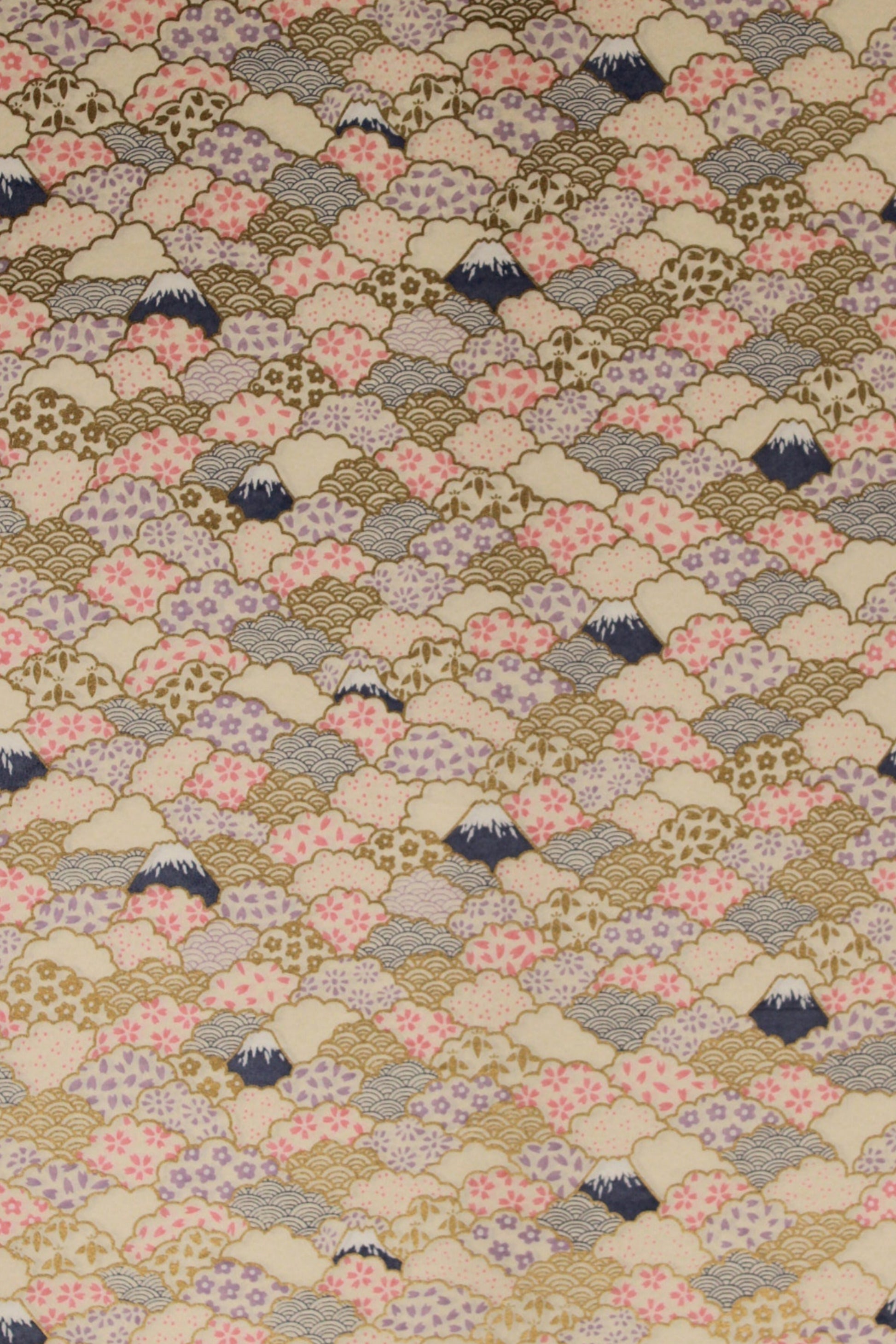 Patterned chiyogami paper with small floral and geometric shapes on a beige background