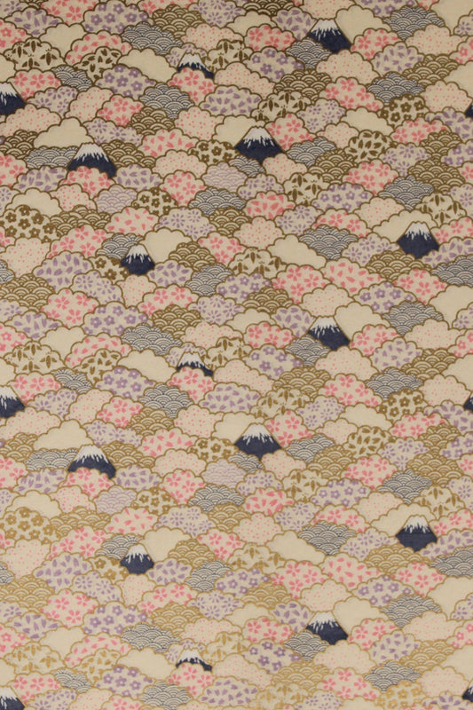 Patterned chiyogami paper with small floral and geometric shapes on a beige background