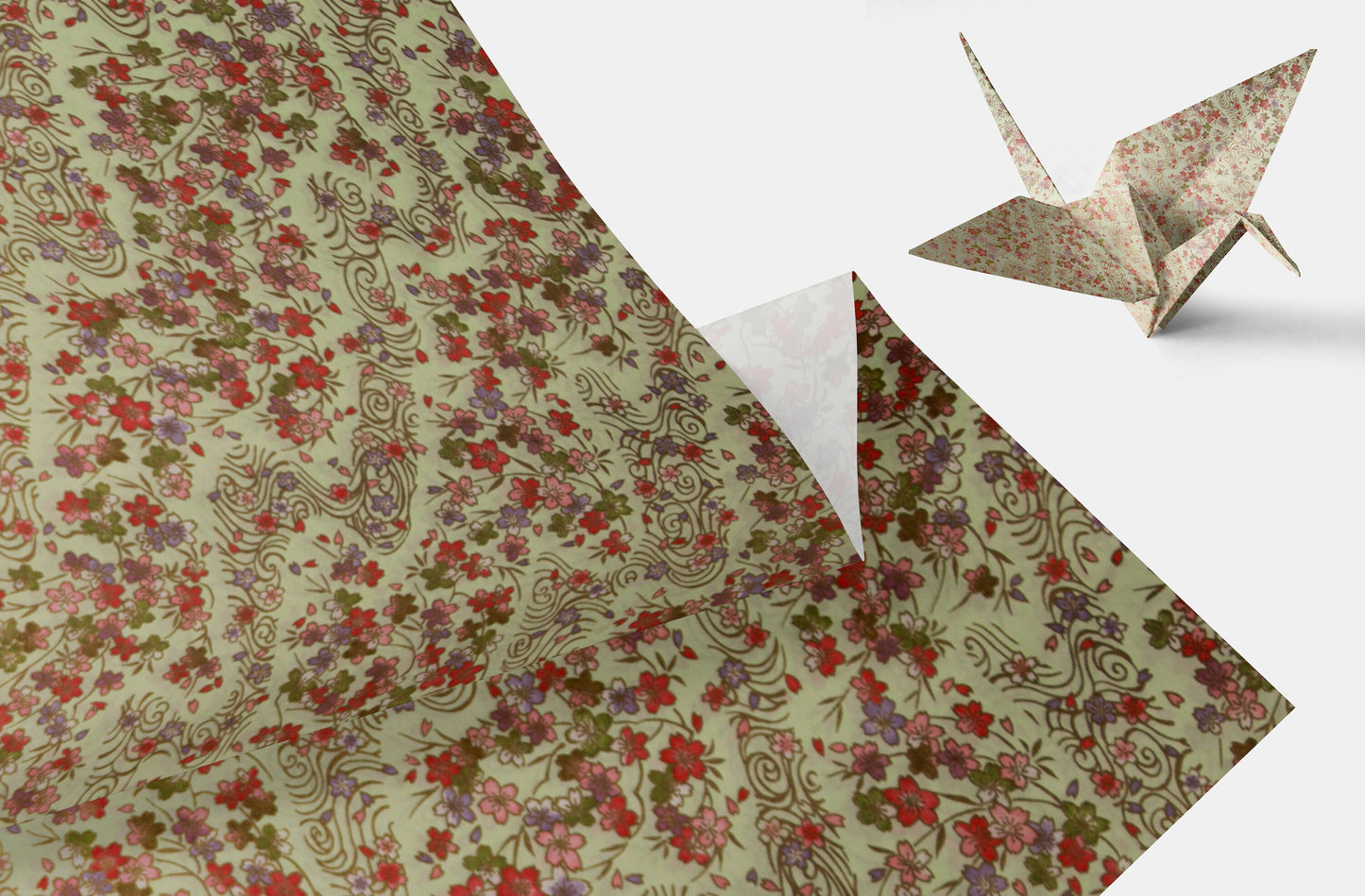 Floral-patterned chiyogami paper with a folded paper crane