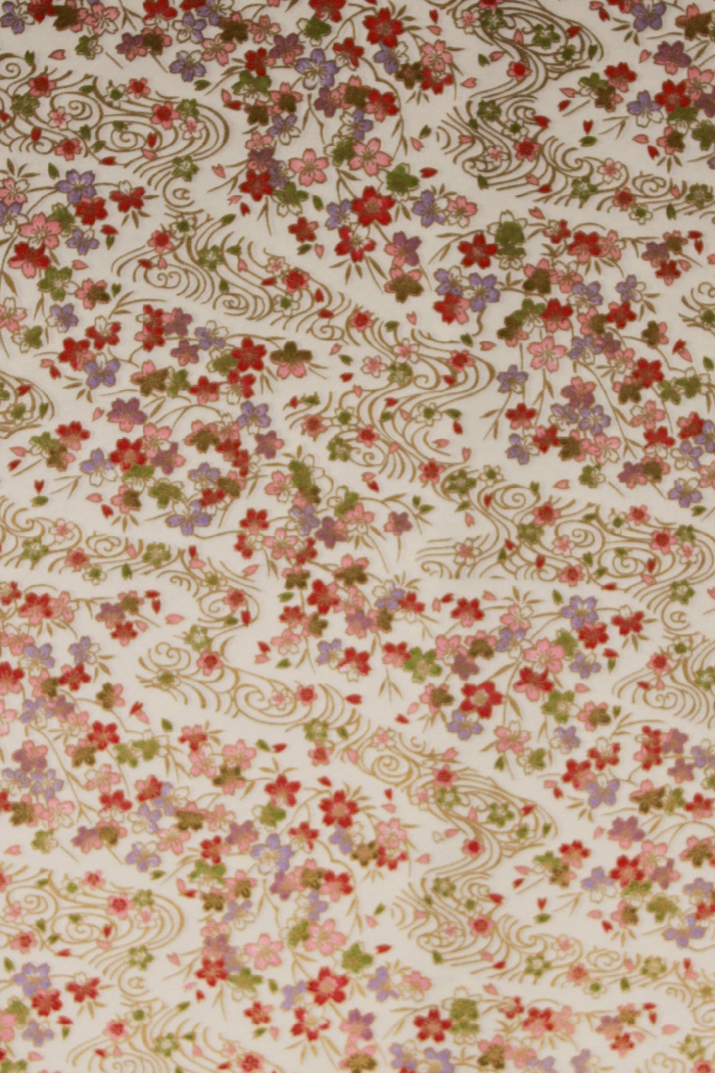 Floral patterned chiyogami paper with small flowers on a beige background
