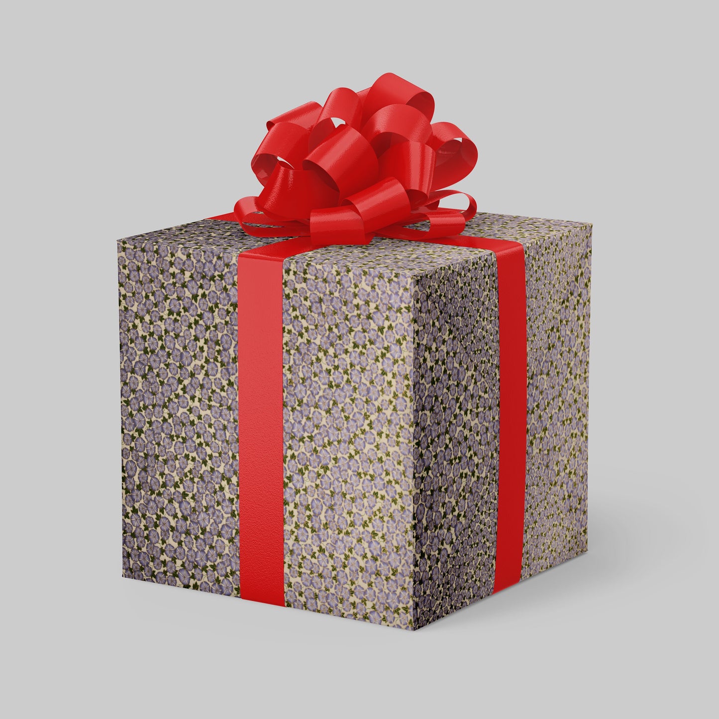 Gift box wrapped with chiyogami paper with red ribbon and bow on a gray background