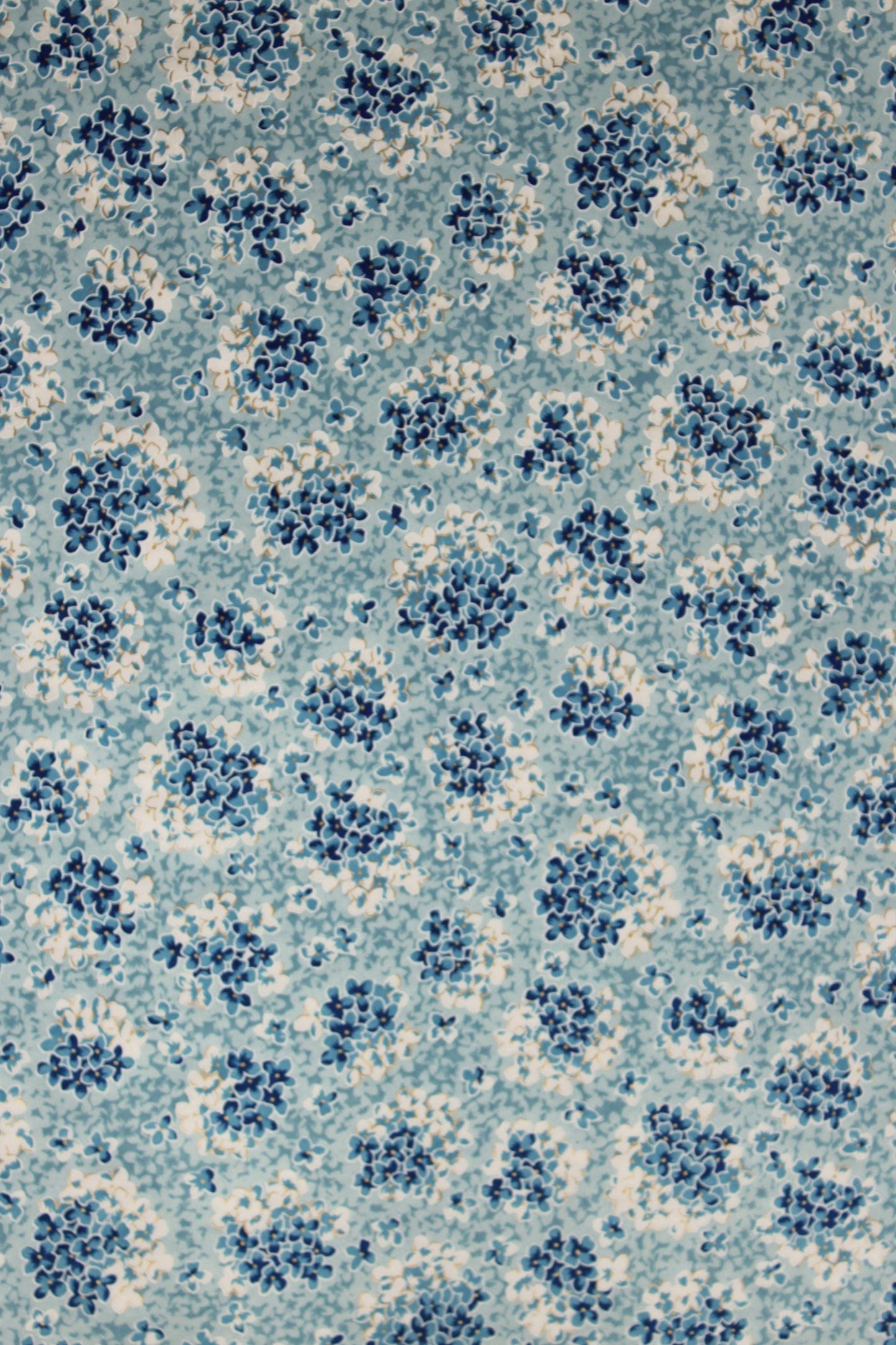 Patterned chiyogami paper with blue and white design on a blue background