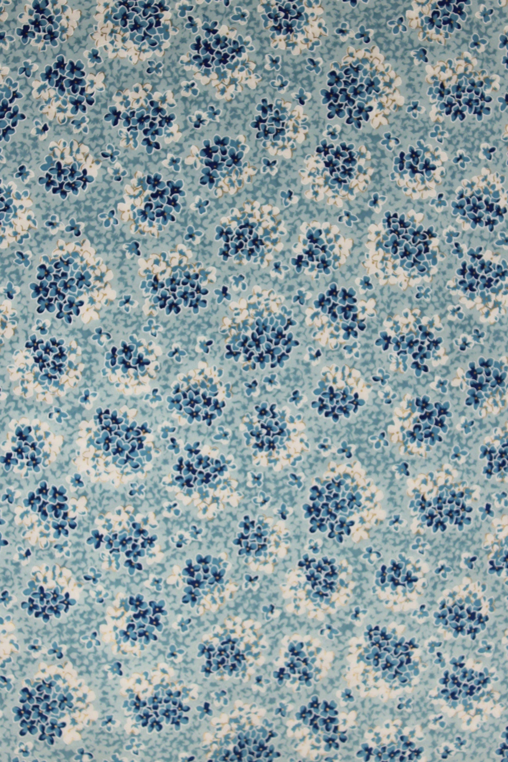 Patterned chiyogami paper with blue and white design on a blue background
