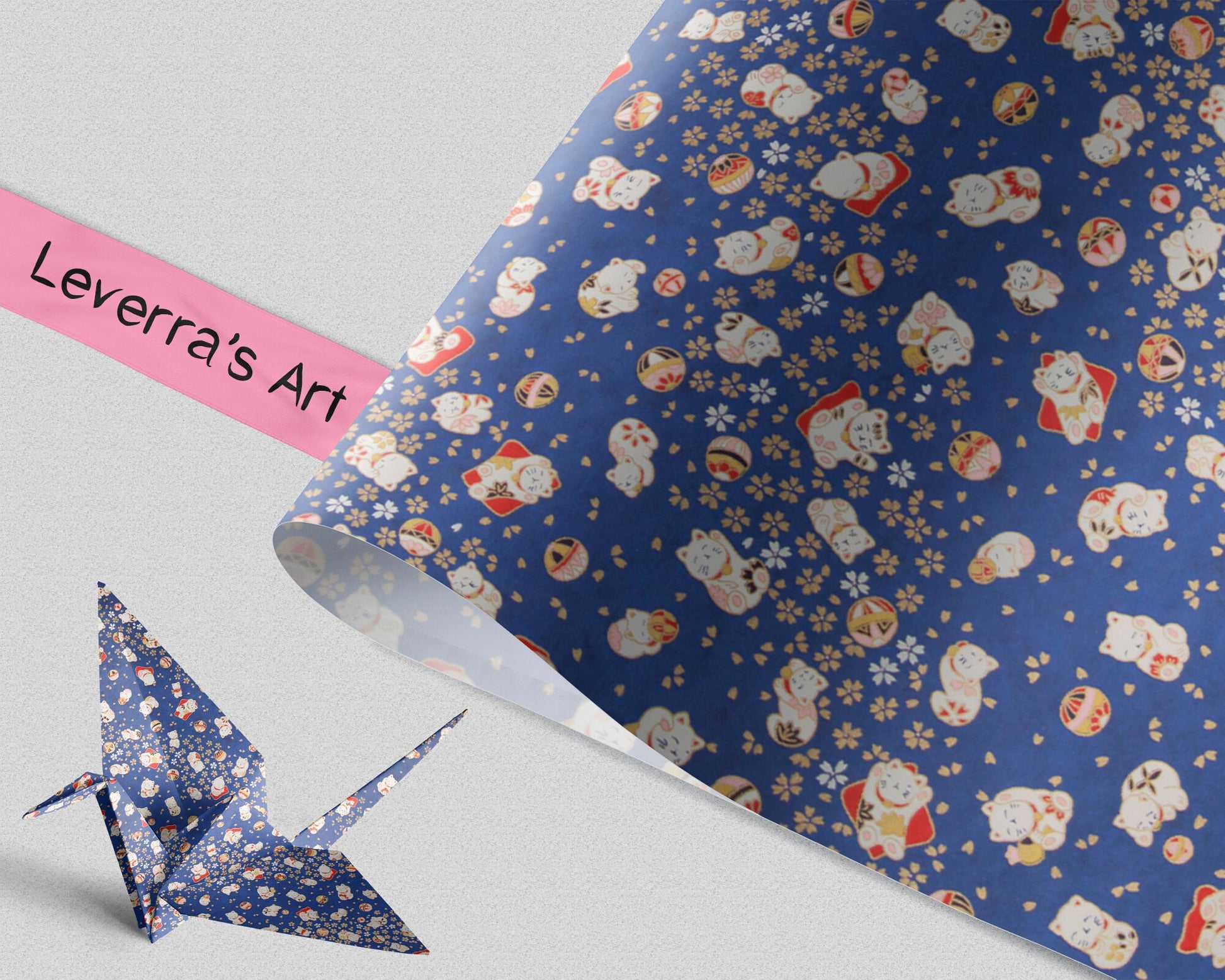 Blue patterned chiyogami paper with lucky cat characters and an origami crane on a light gray background featuring a "Leverra's Art" label.