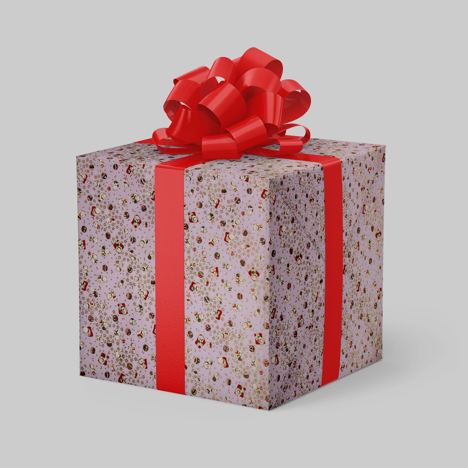 Gift box with floral pattern and red ribbon on a light gray background