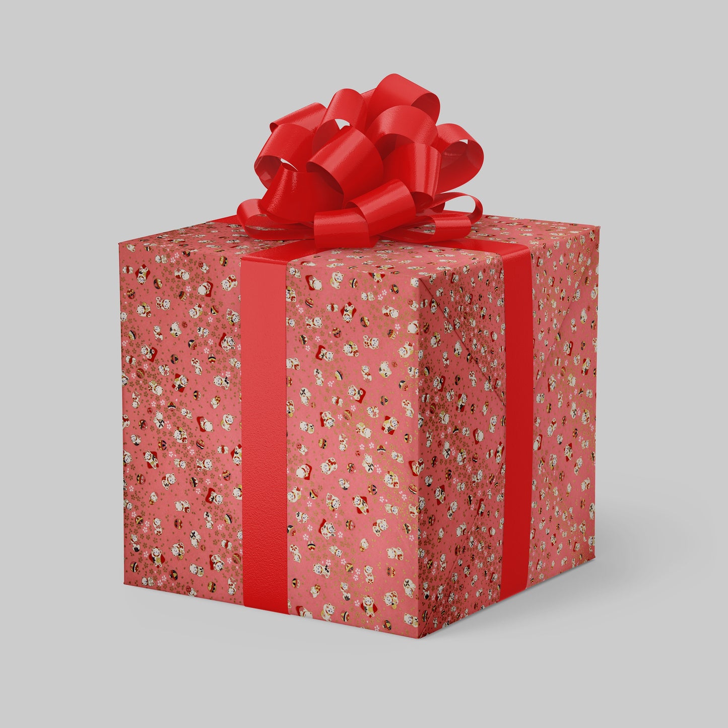 Gift box with red floral pattern and large red bow on a light gray background