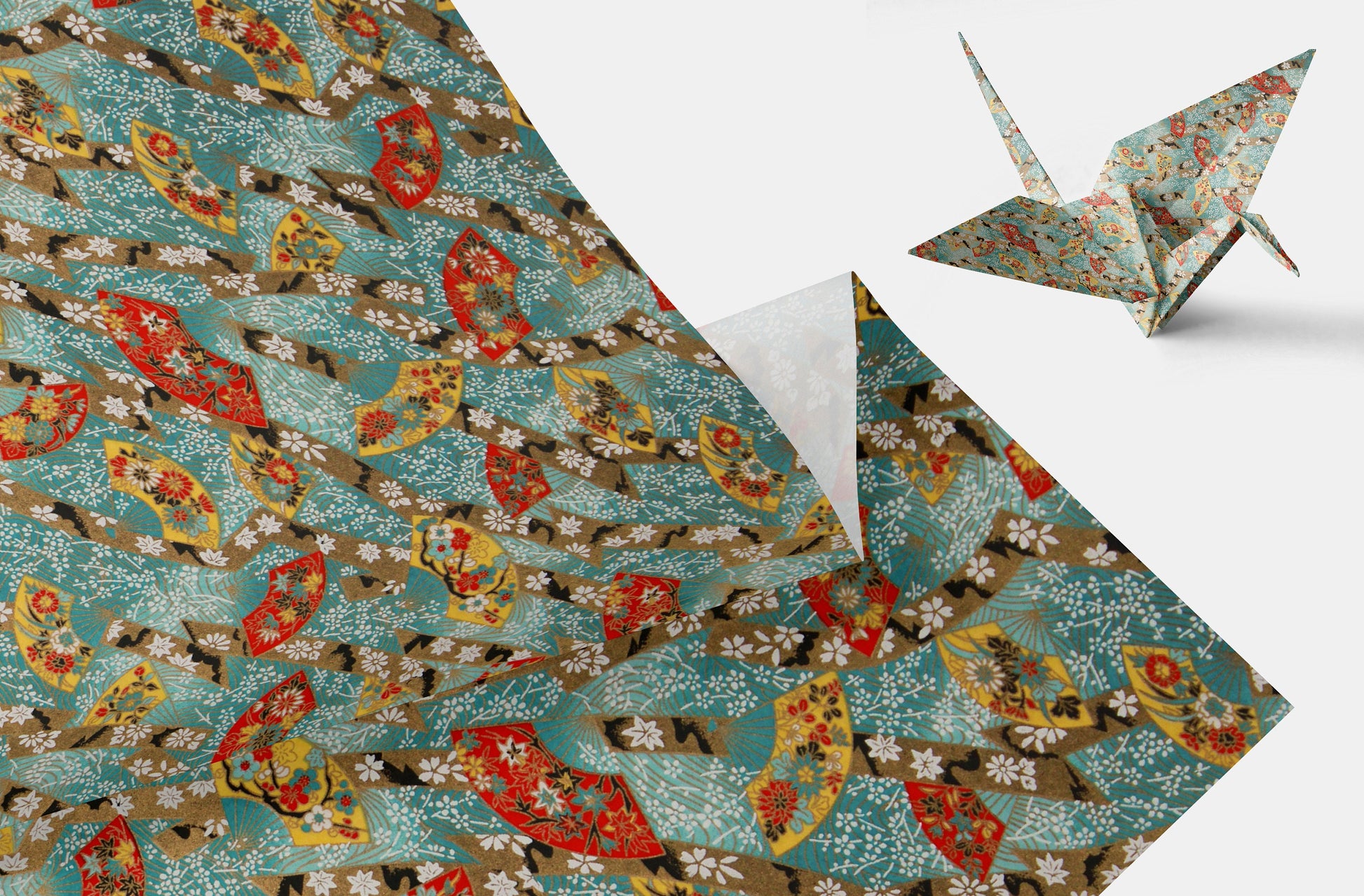 Decorative chiyogami paper with a floral pattern and a folded paper crane on a white background