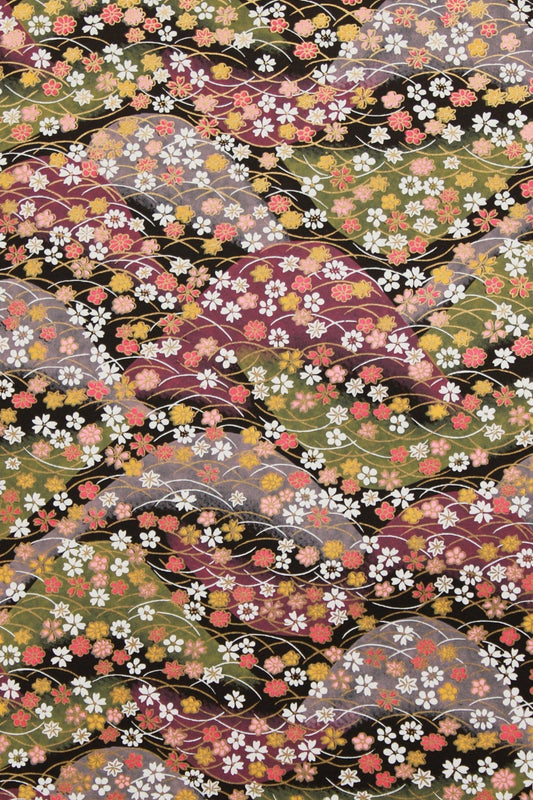 Patterned  chiyogami paper with multicolored flowers on a black background