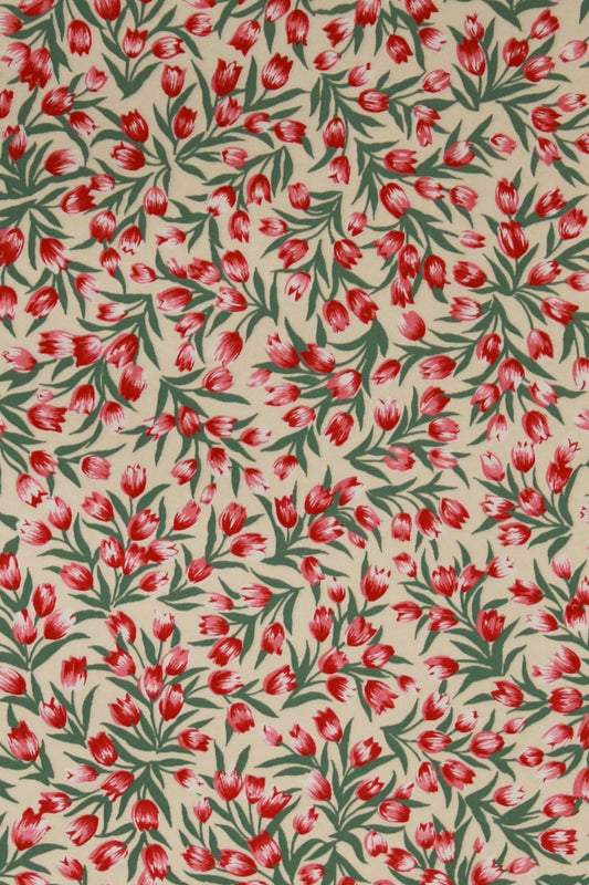 Paper with red floral pattern on a beige background