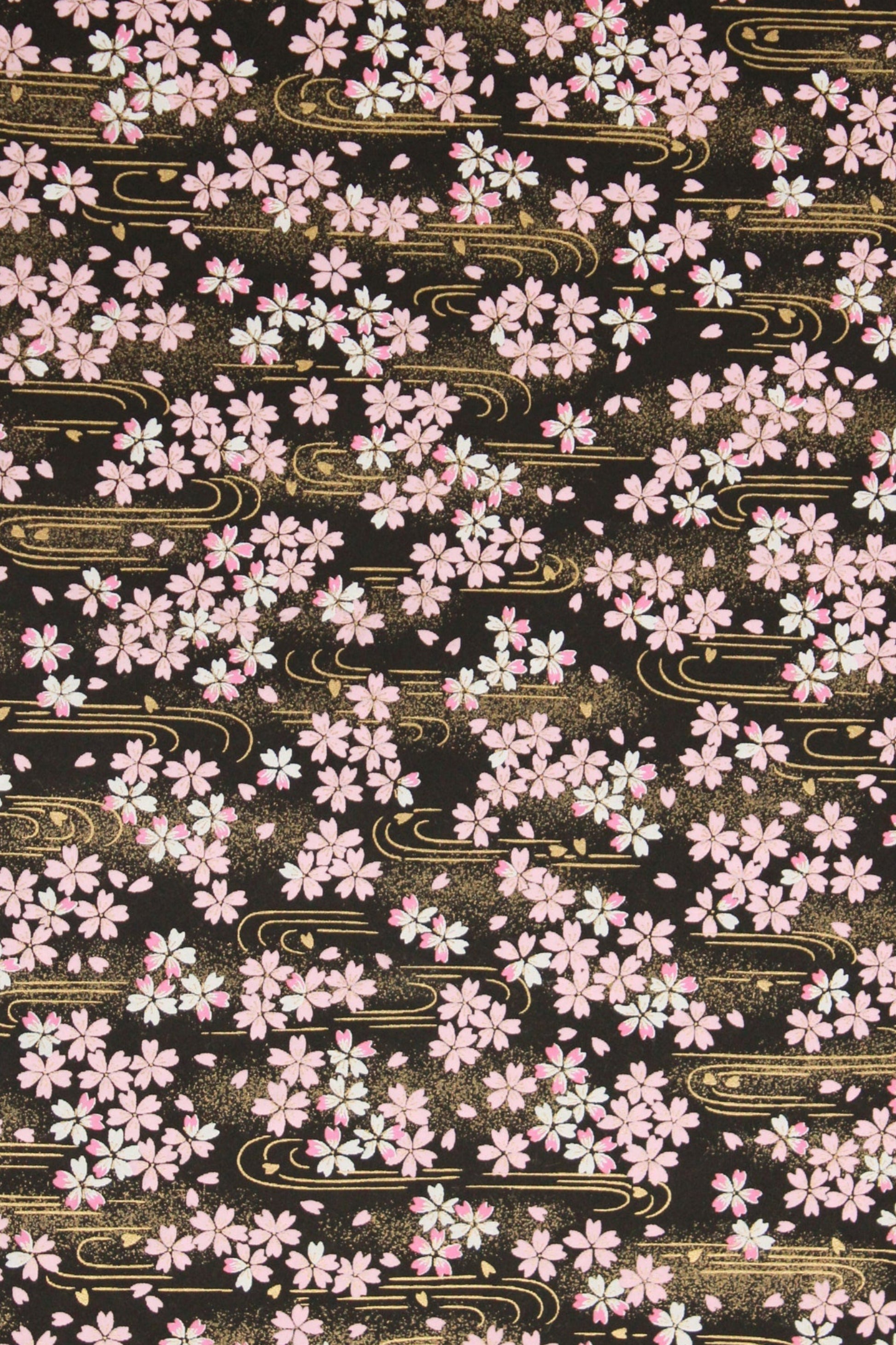 Pattern of pink flowers on a black background