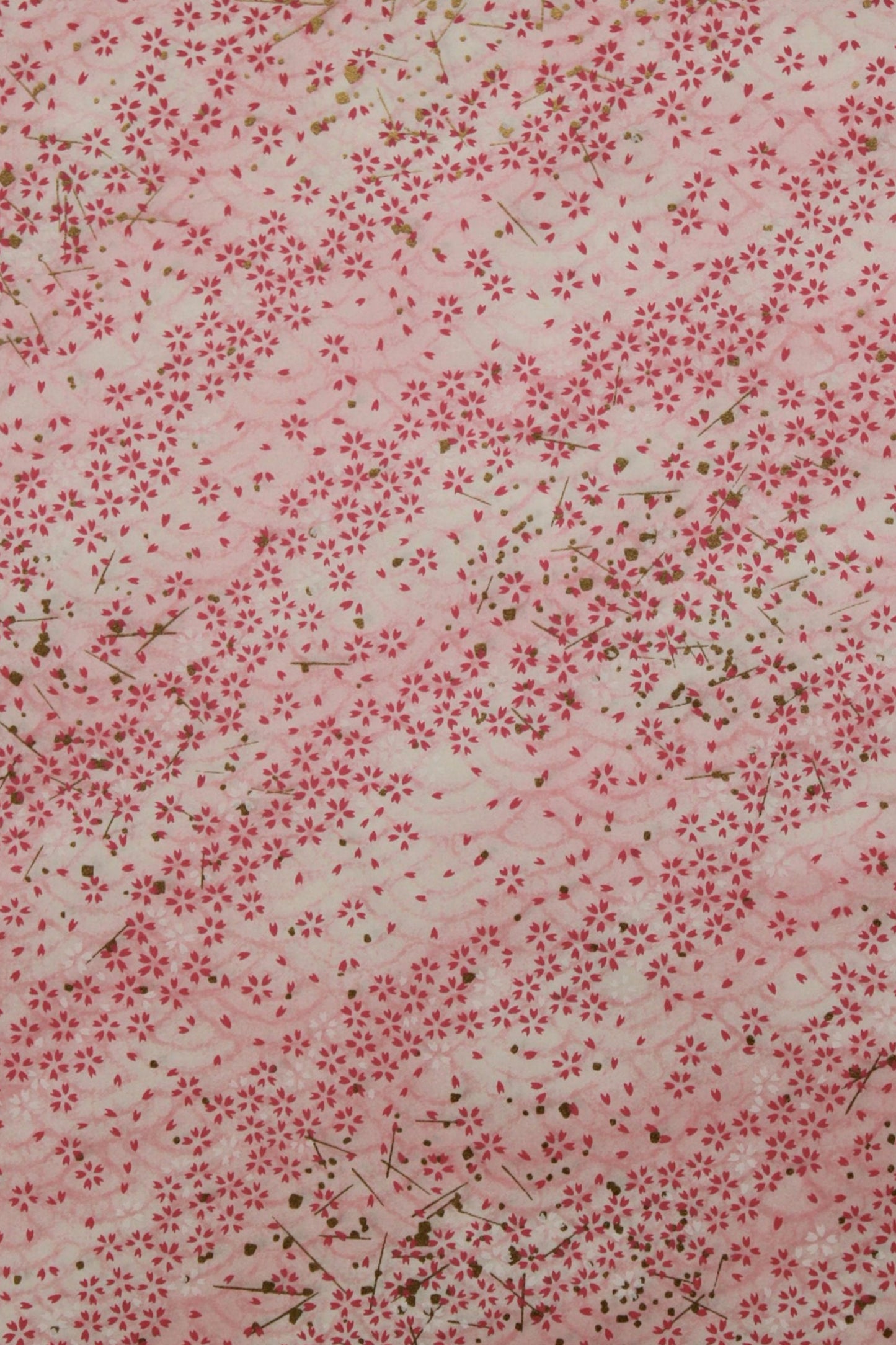 Floral patterned  chiyogami paper with small red flowers on a light background