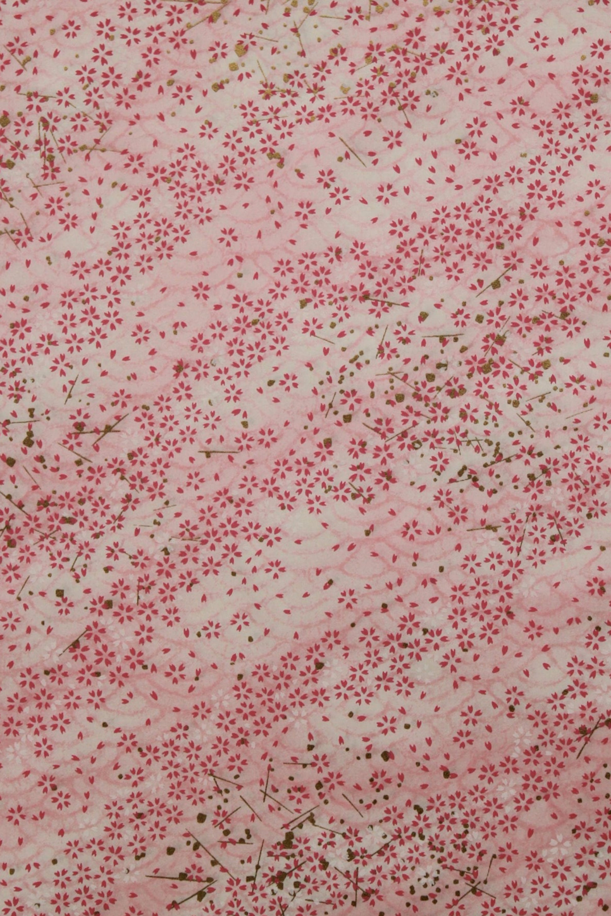 Floral patterned  chiyogami paper with small red flowers on a light background
