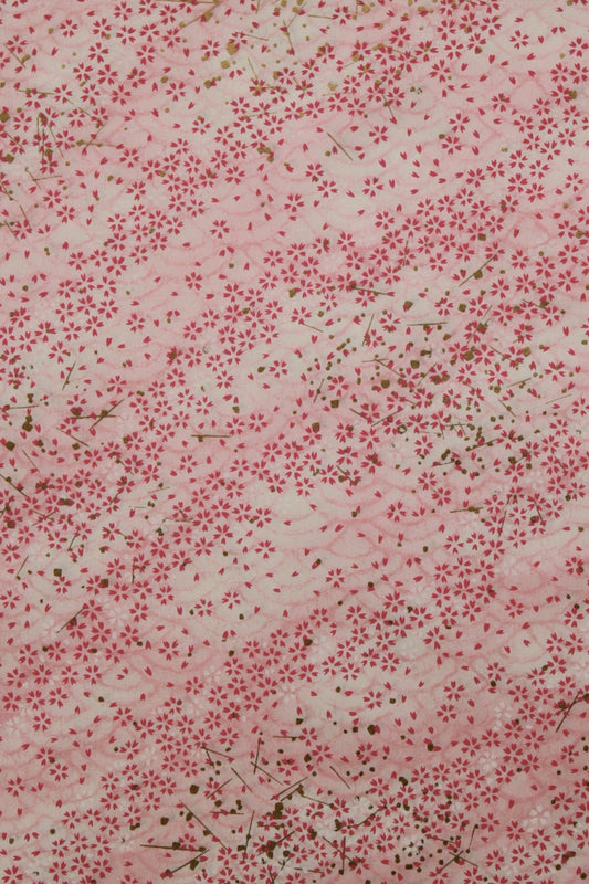 Floral patterned  chiyogami paper with small red flowers on a light background