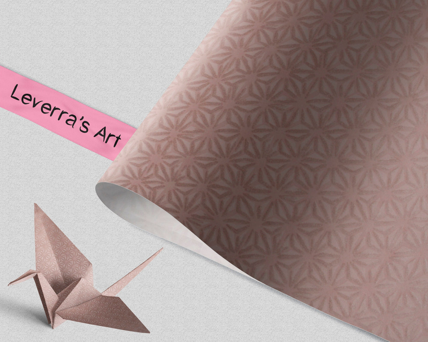 Origami crane next to patterned chiyogami paper with 'Leverra's Art' branding