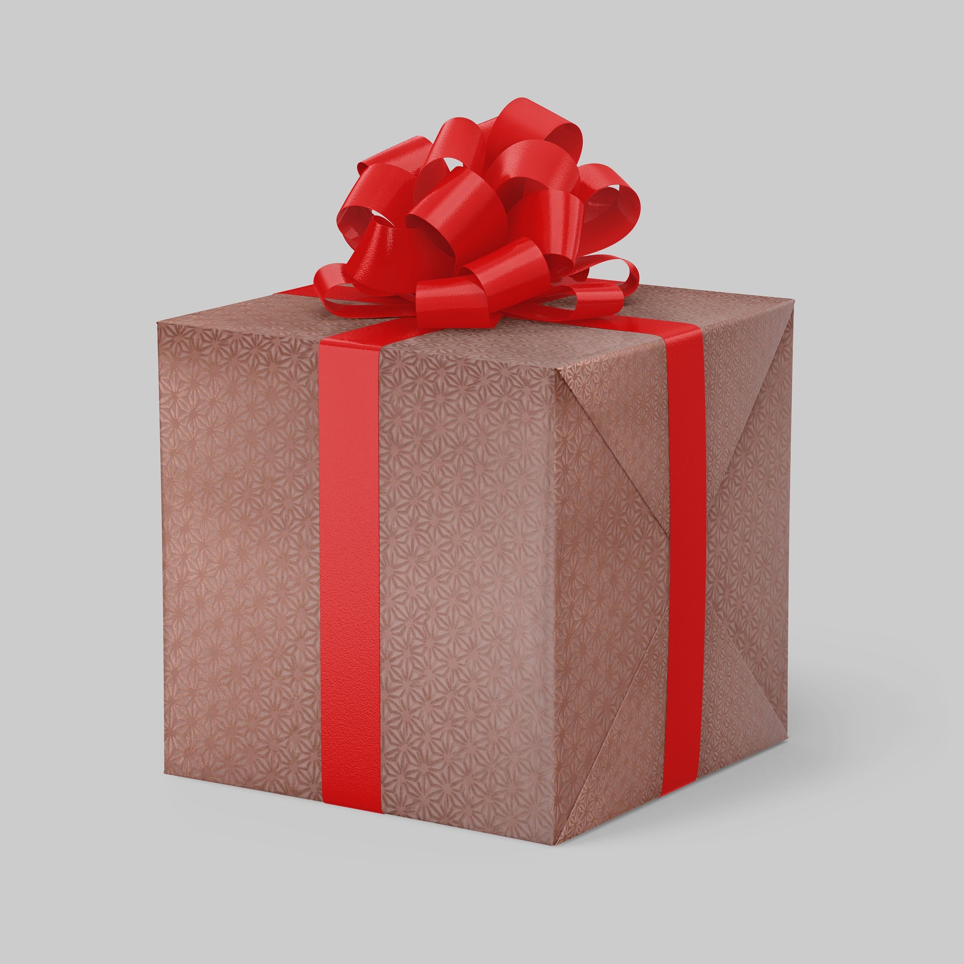 Gift box wrapped with chiyogami paper with red ribbon and bow on a light gray background