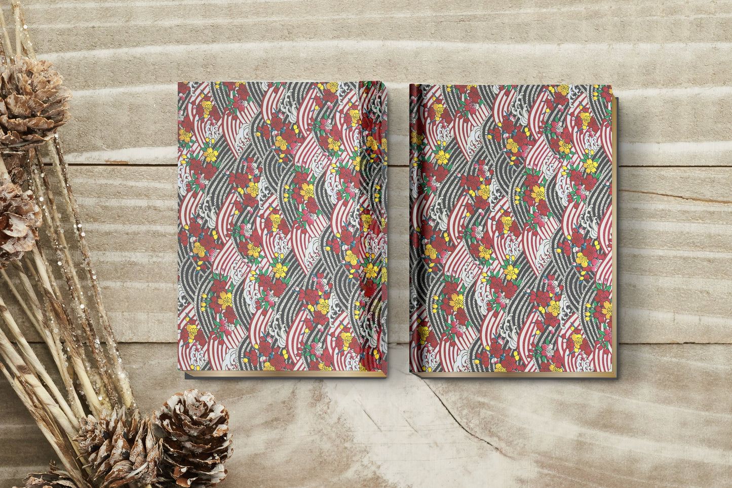 Two patterned books on a wooden surface with decorative elements.