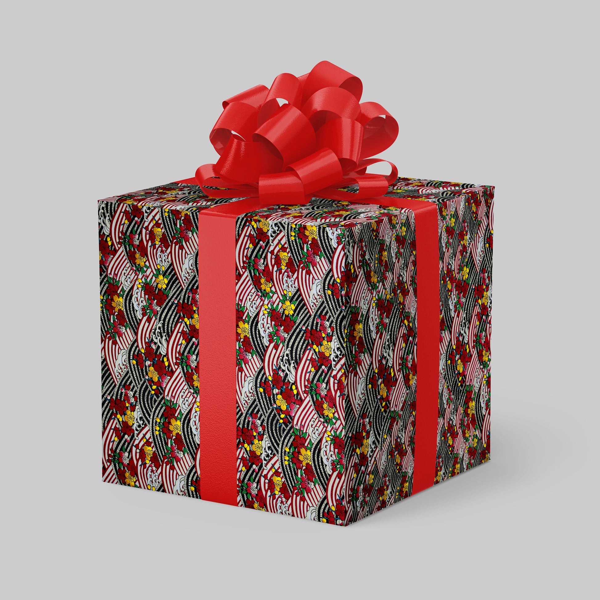 Gift box with colorful pattern and red bow on a gray background