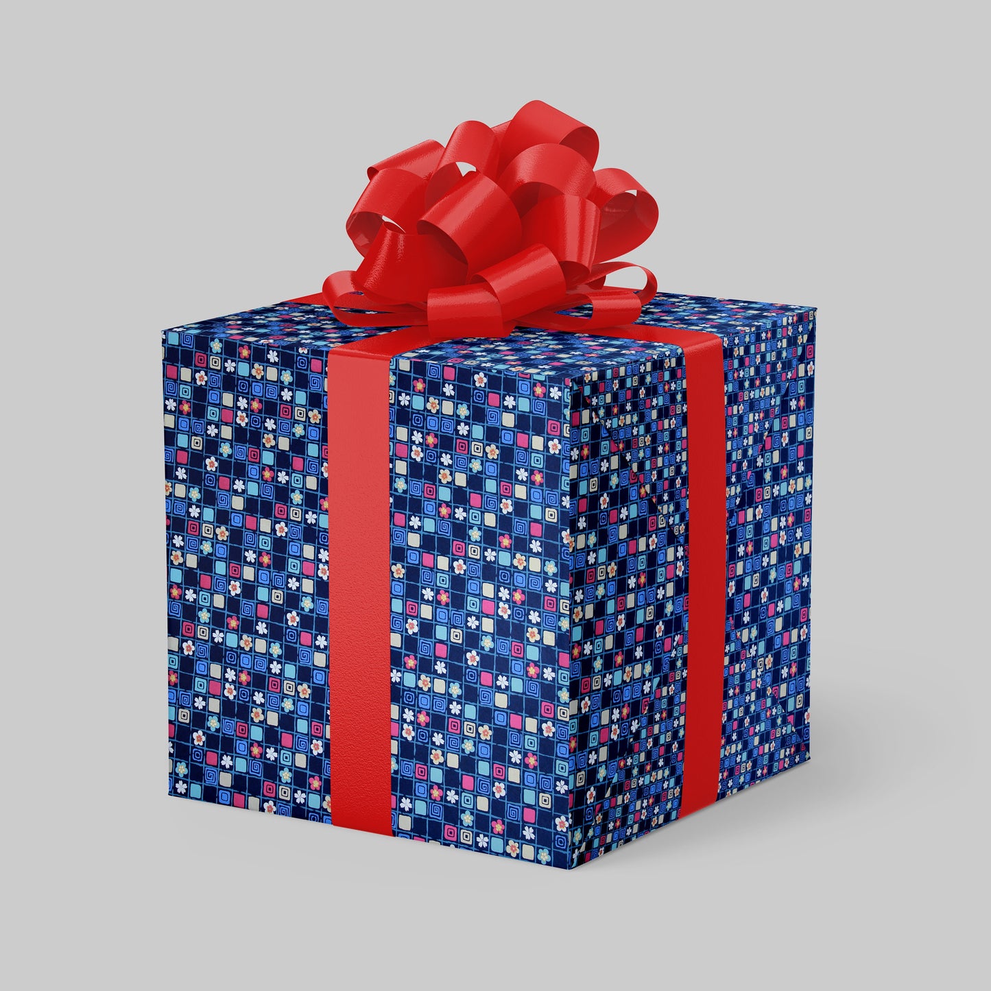 Gift box wrapped with chiyogami paper with blue pattern and red ribbon on a gray background