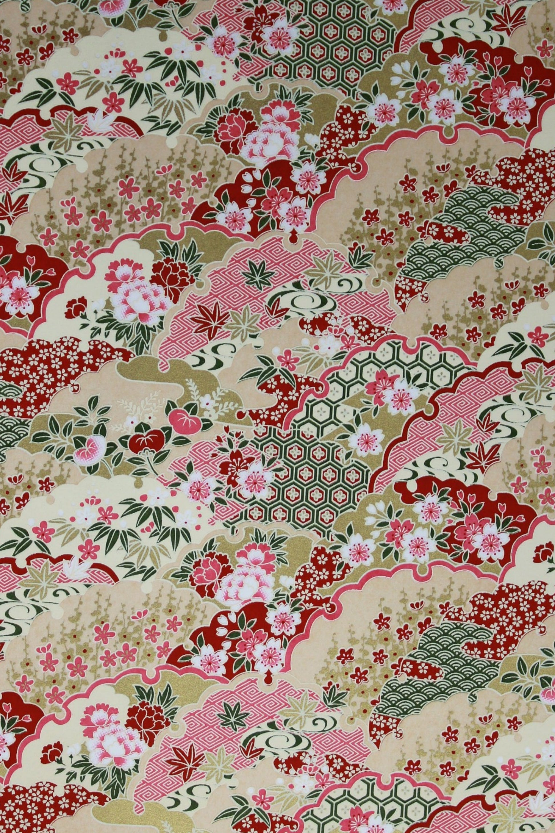 Floral patterned chiyogami paper with pink, red, and green colors on a beige background