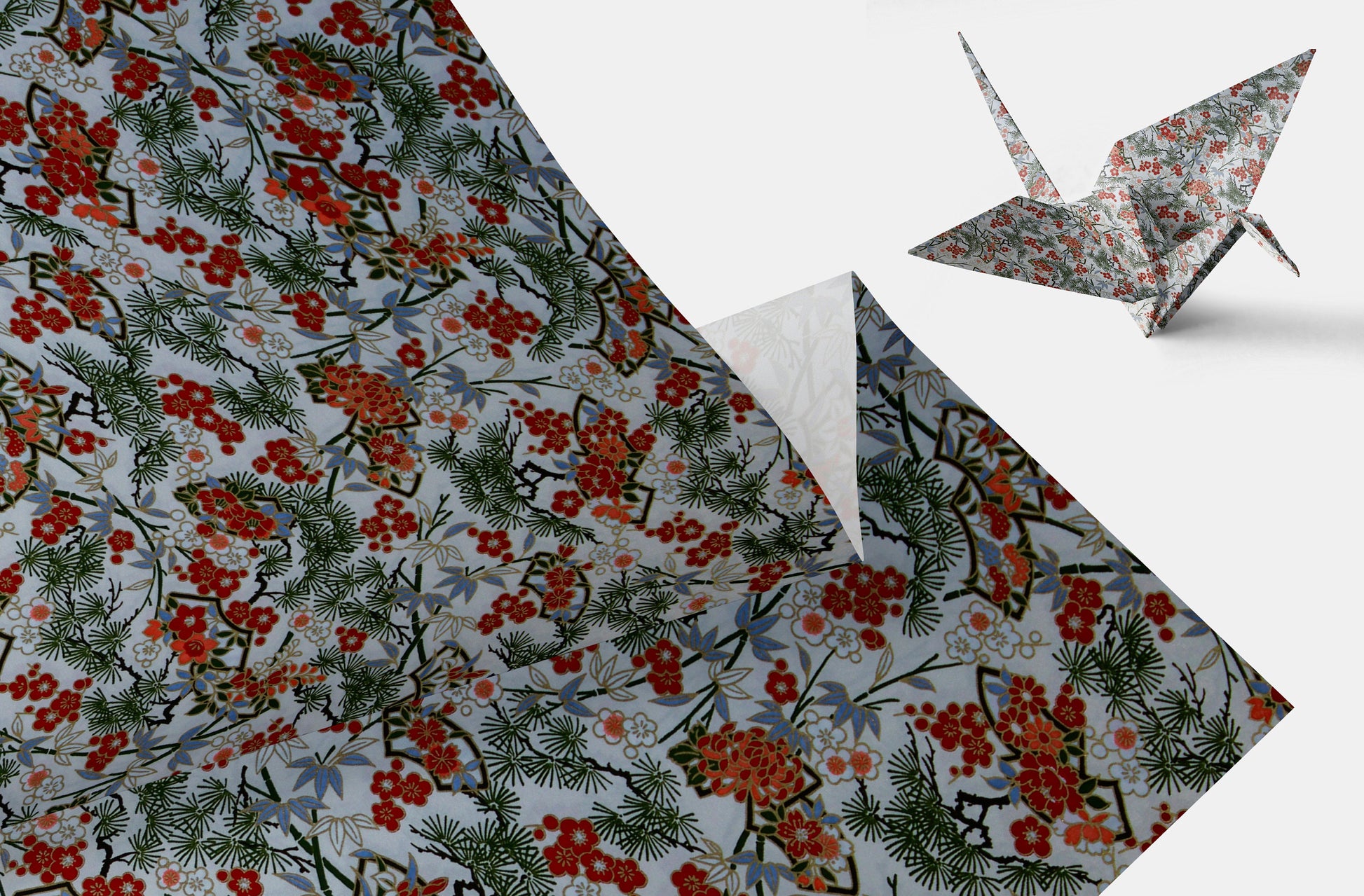 Floral-patterned chiyogami paper with a folded crane on a white background
