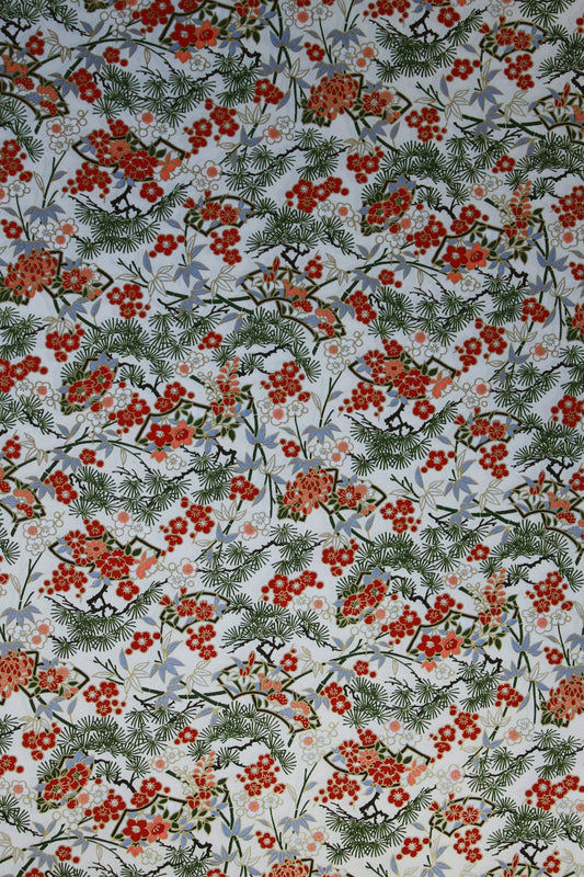 Festive chiyogami paper pattern with red berries and green leaves on a light background