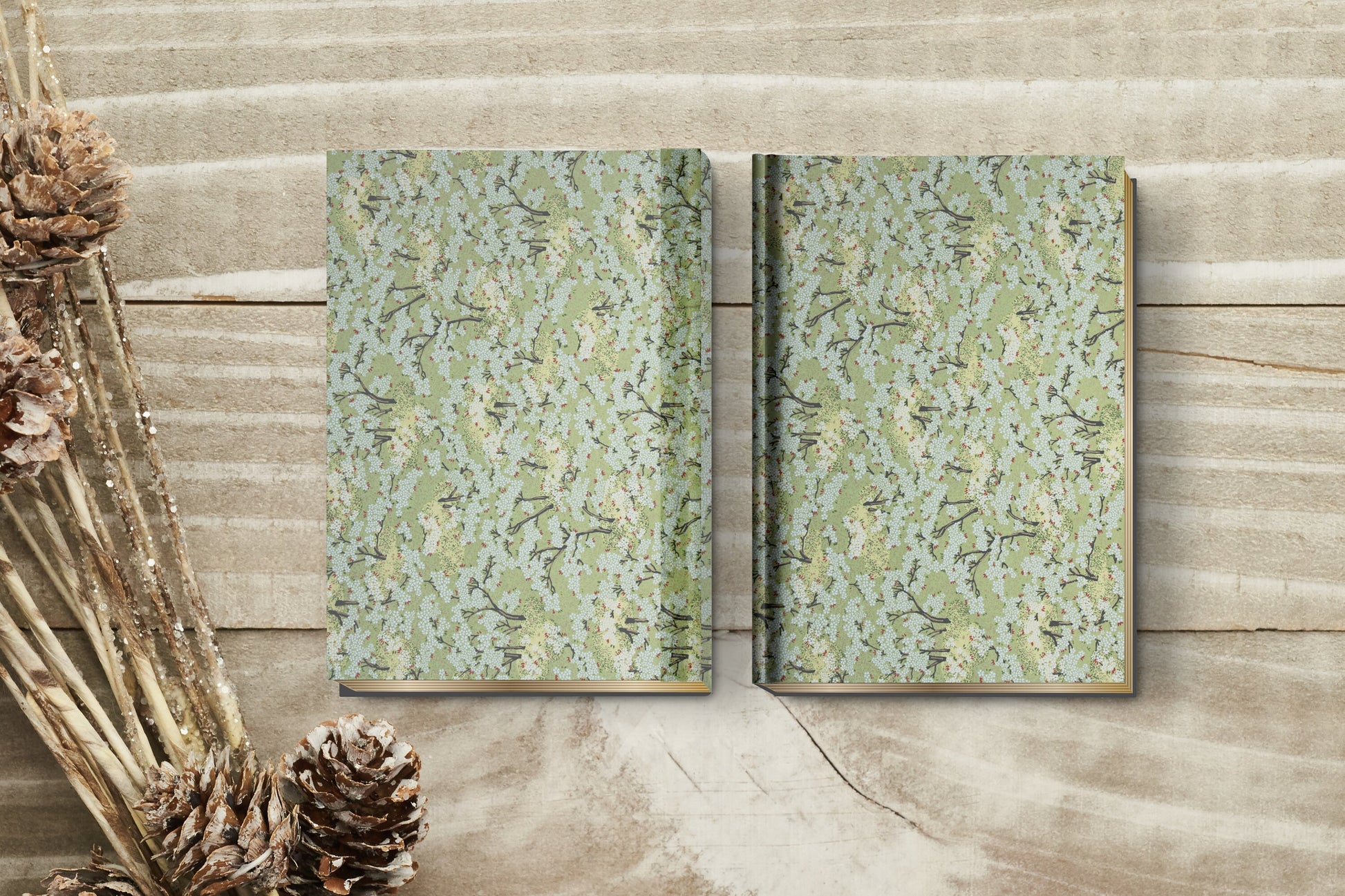 Two patterned books on a wooden surface with decorative elements.