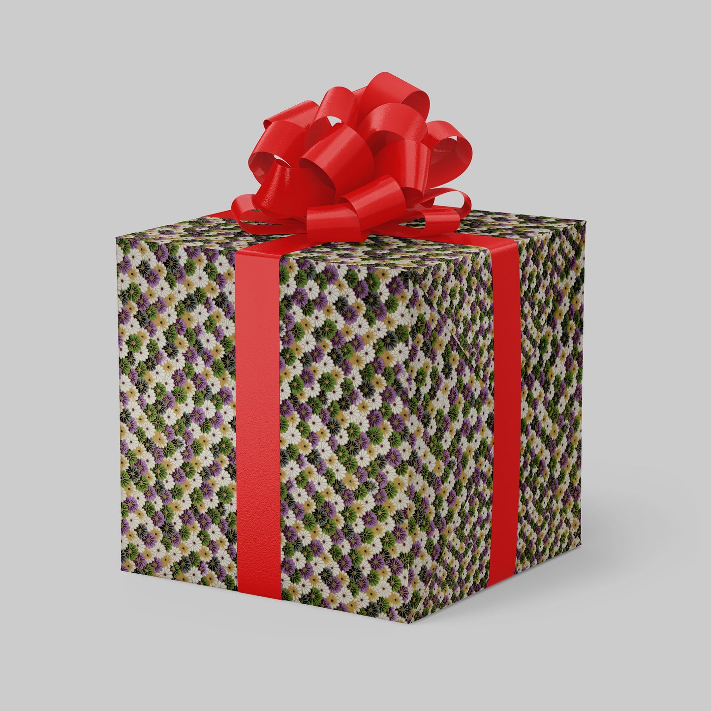 Gift box wrapped with chiyogami paper with floral pattern and red ribbon on a gray background