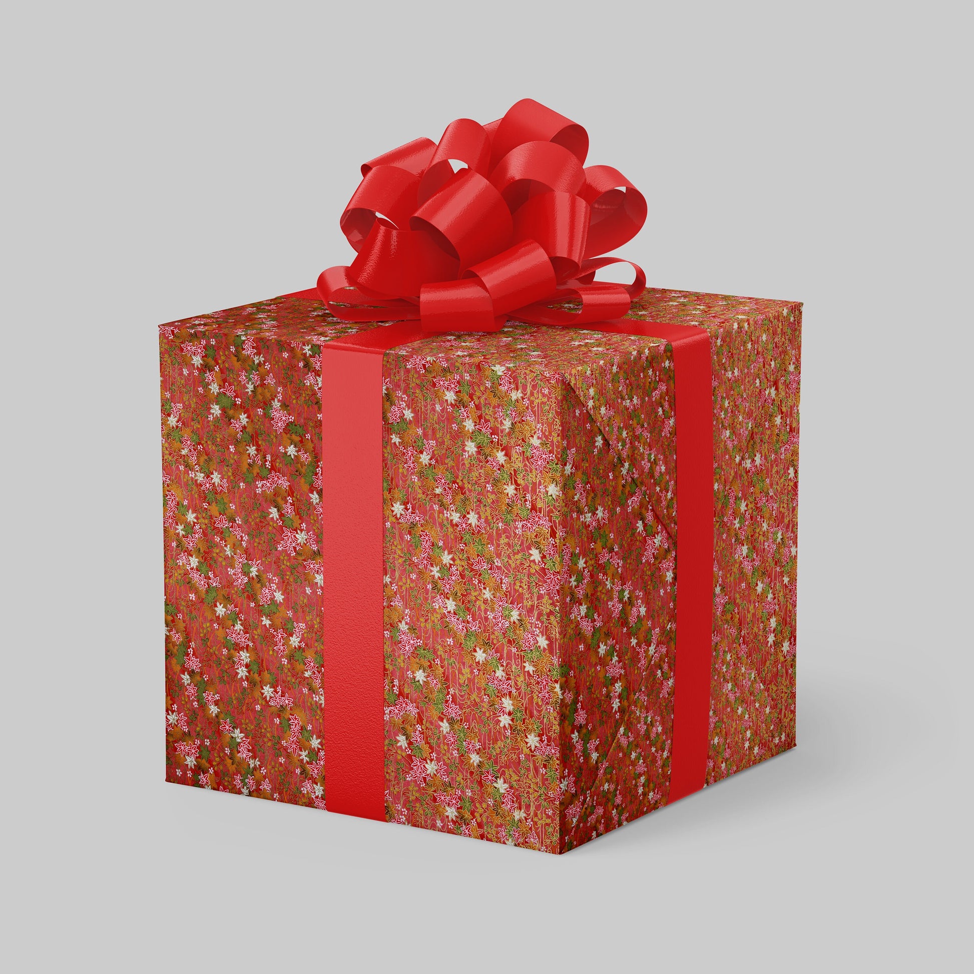 Gift box with floral pattern and red ribbon on a gray background