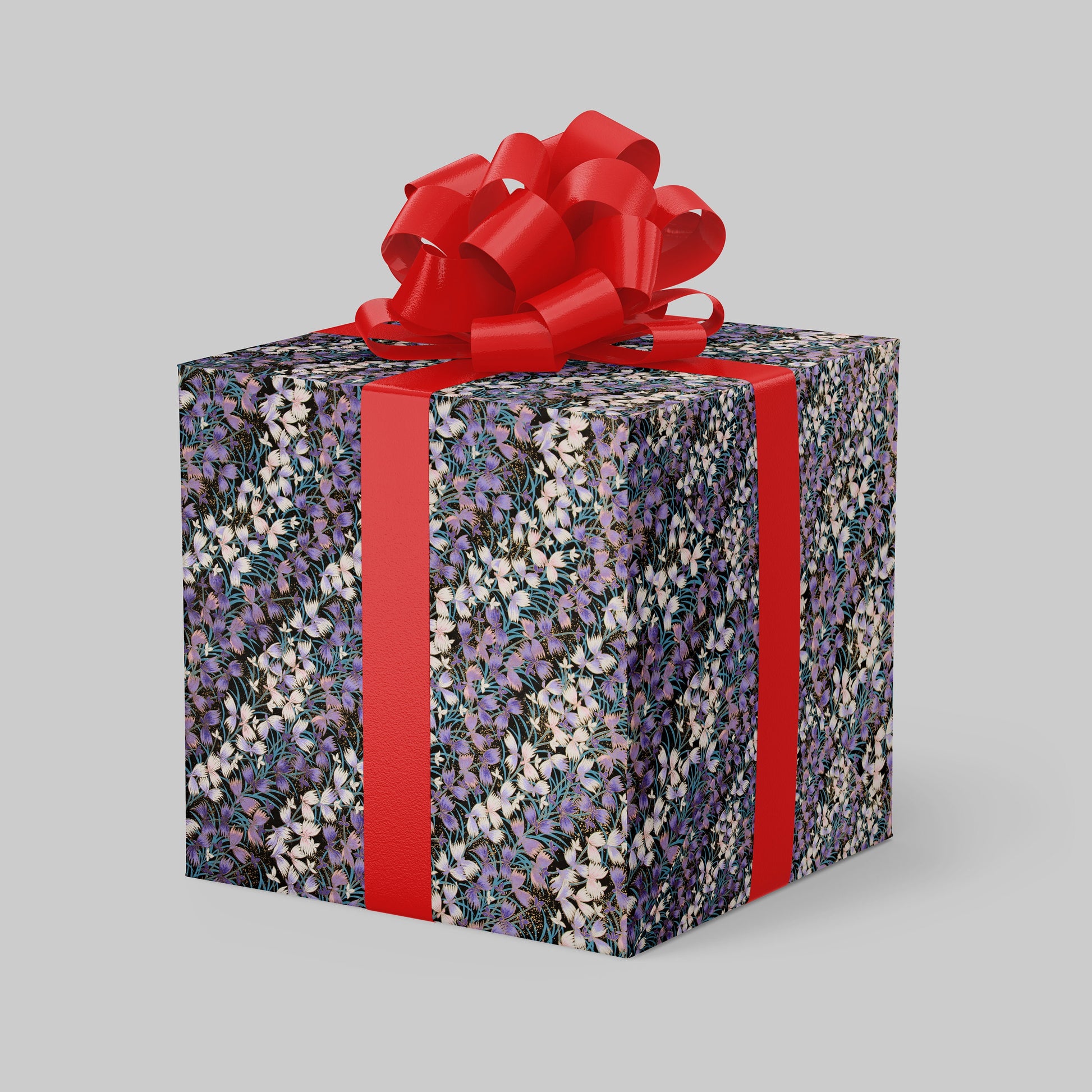 Gift box with floral pattern and red ribbon on a gray background
