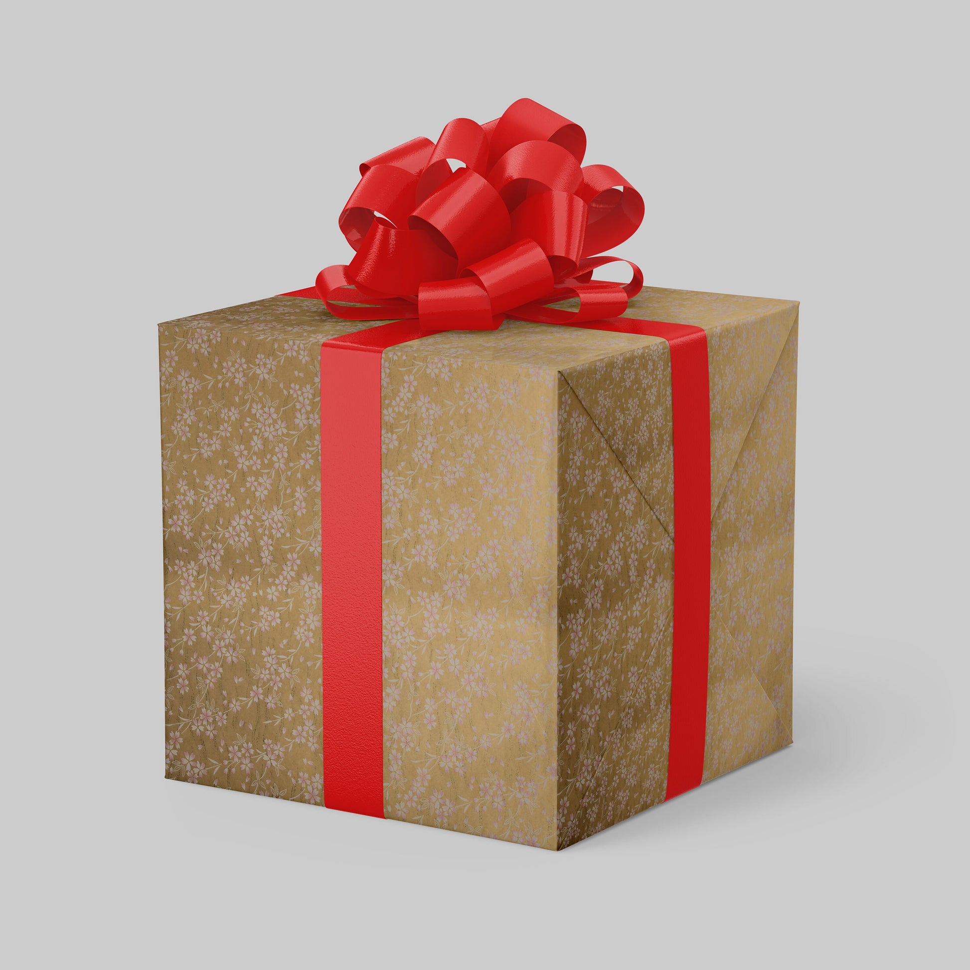 Gift box  wrapped with chiyogami paper with a red ribbon and bow on a light gray background