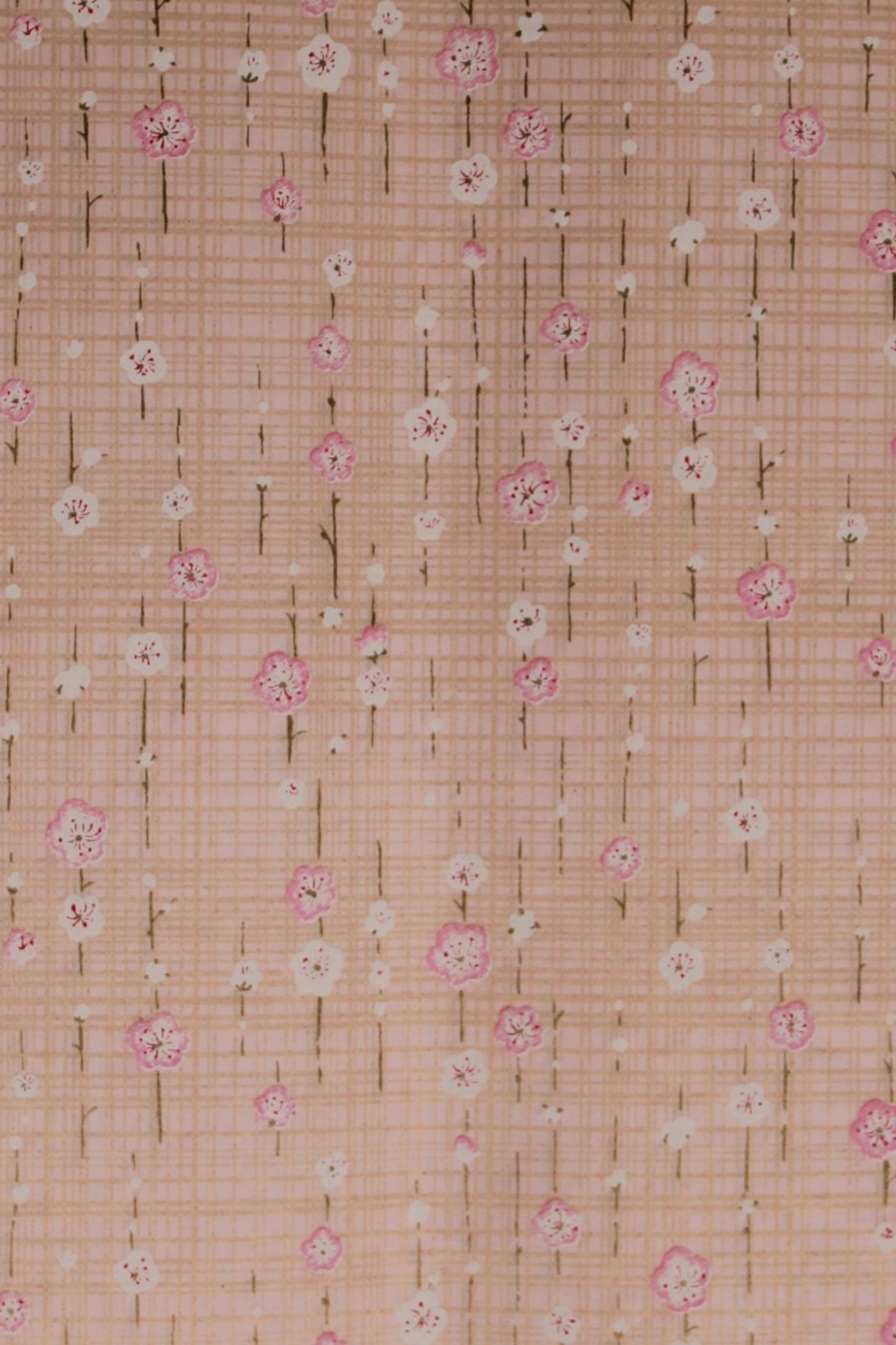 Chiyogami paper with a subtle pattern on a light pink background