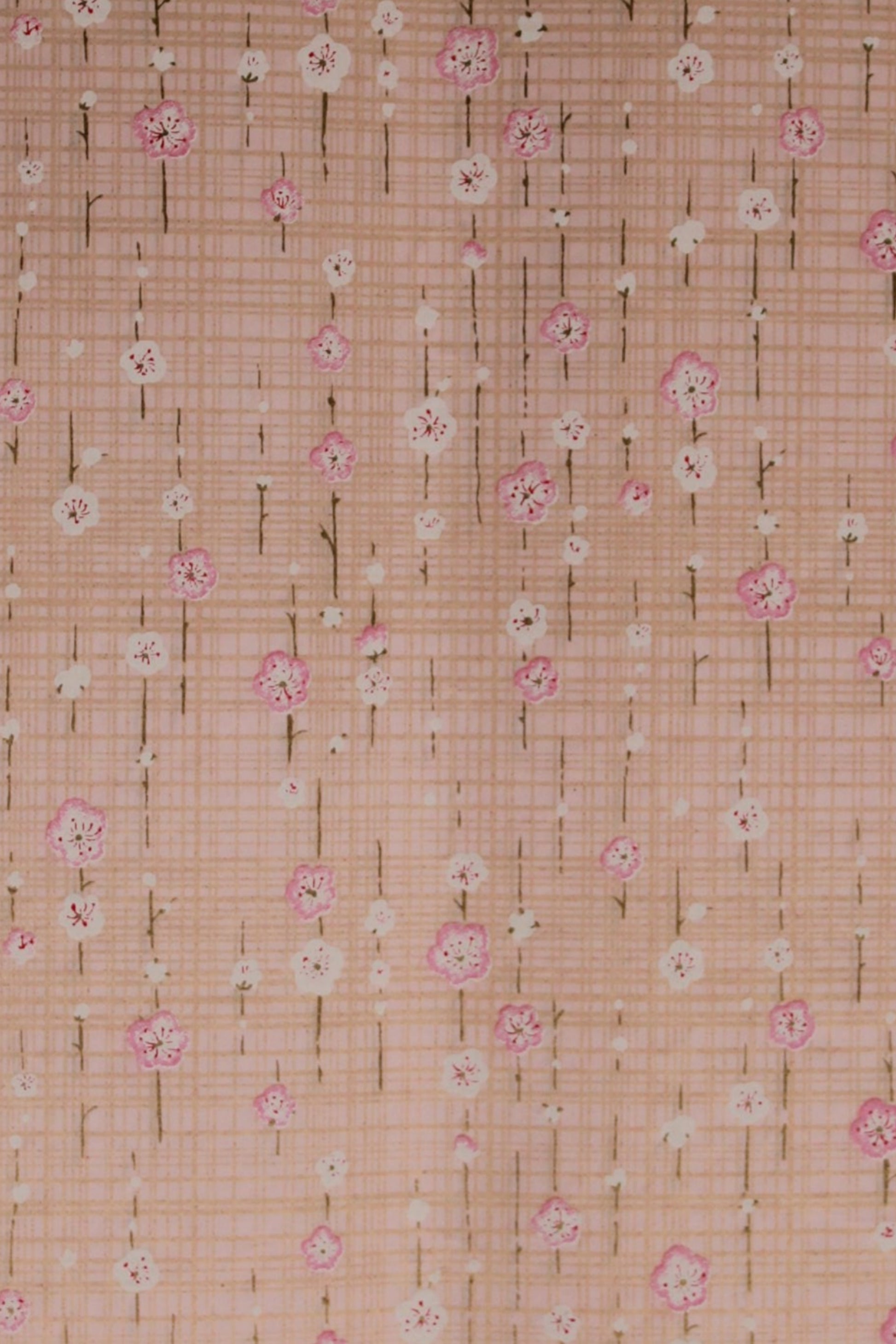 Chiyogami paper with a subtle pattern on a light pink background