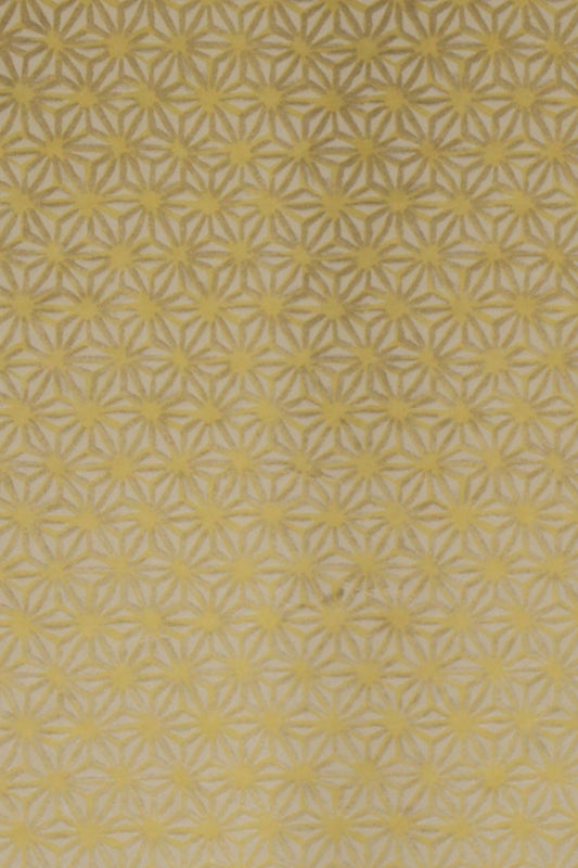 Gold chiyogami paper with a subtle pattern on a plain background