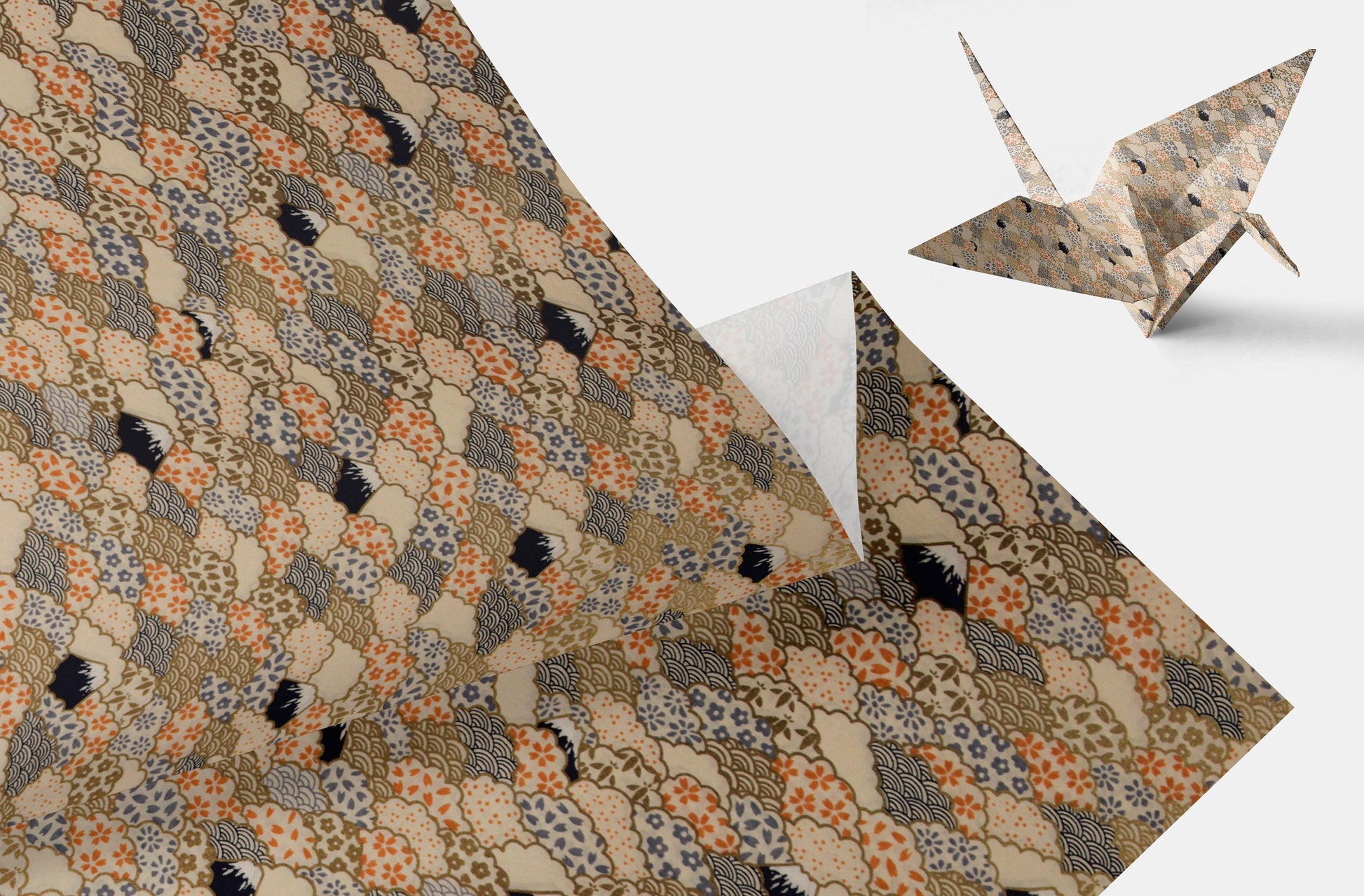 Patterned chiyogami paper with a traditional design and an origami crane on a white background