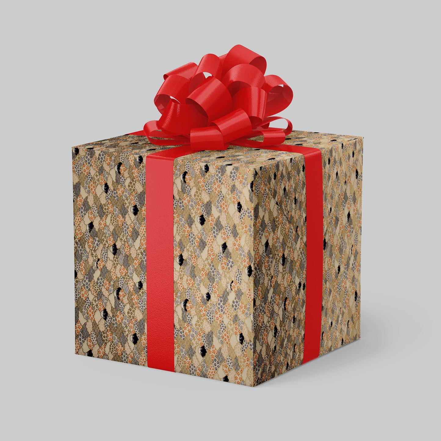 Gift box wrapped with chiyogami paper with patterned wrap and red ribbon on a gray background