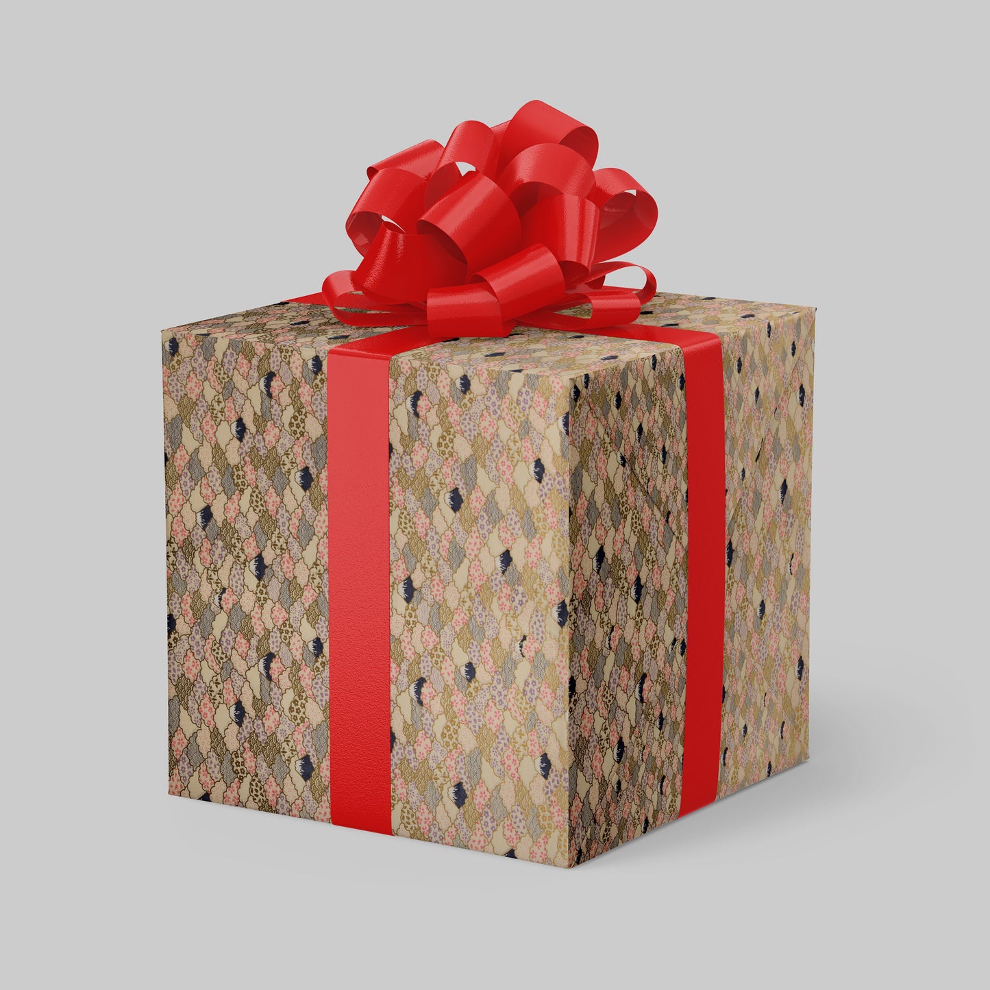 Gift box wrapped with chiyogami paper with floral pattern and red ribbon on a gray background