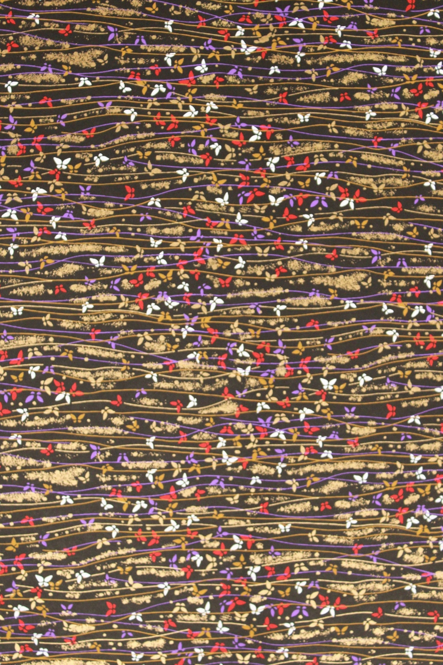 Textured  chiyogami paper pattern with multicolored threads on a beige background