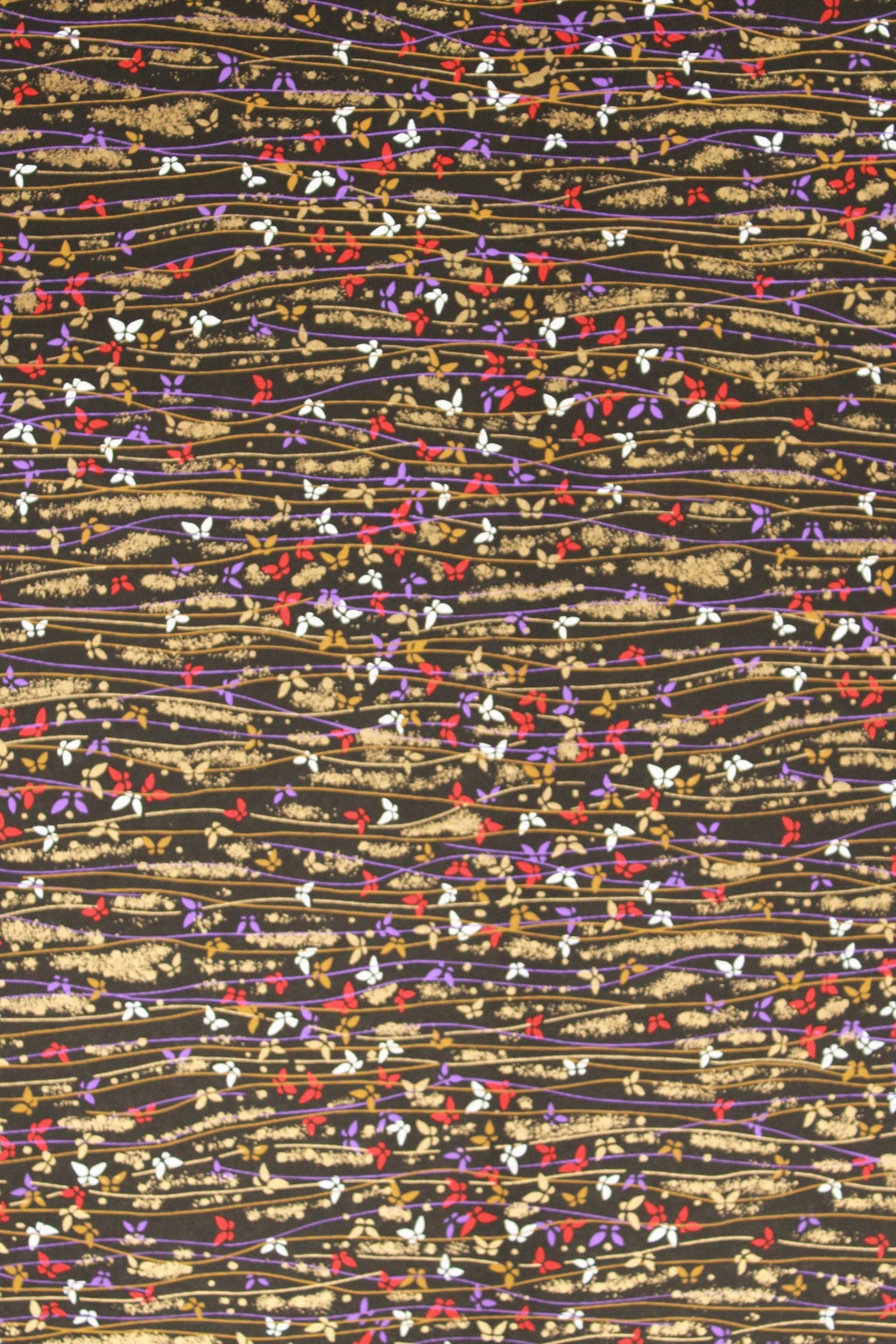 Textured  chiyogami paper pattern with multicolored threads on a beige background