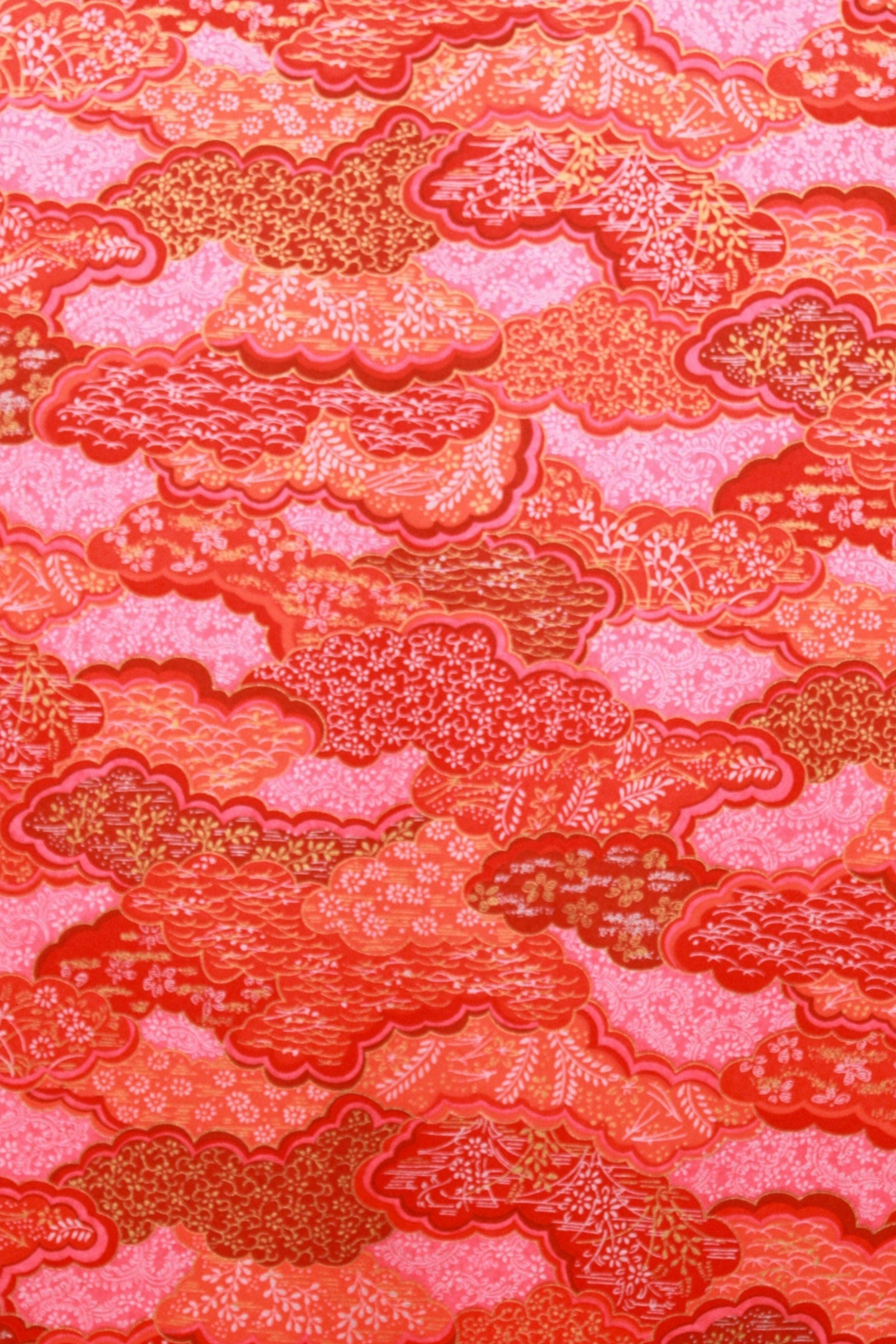 Chiyogami paper with red and pink textured pattern