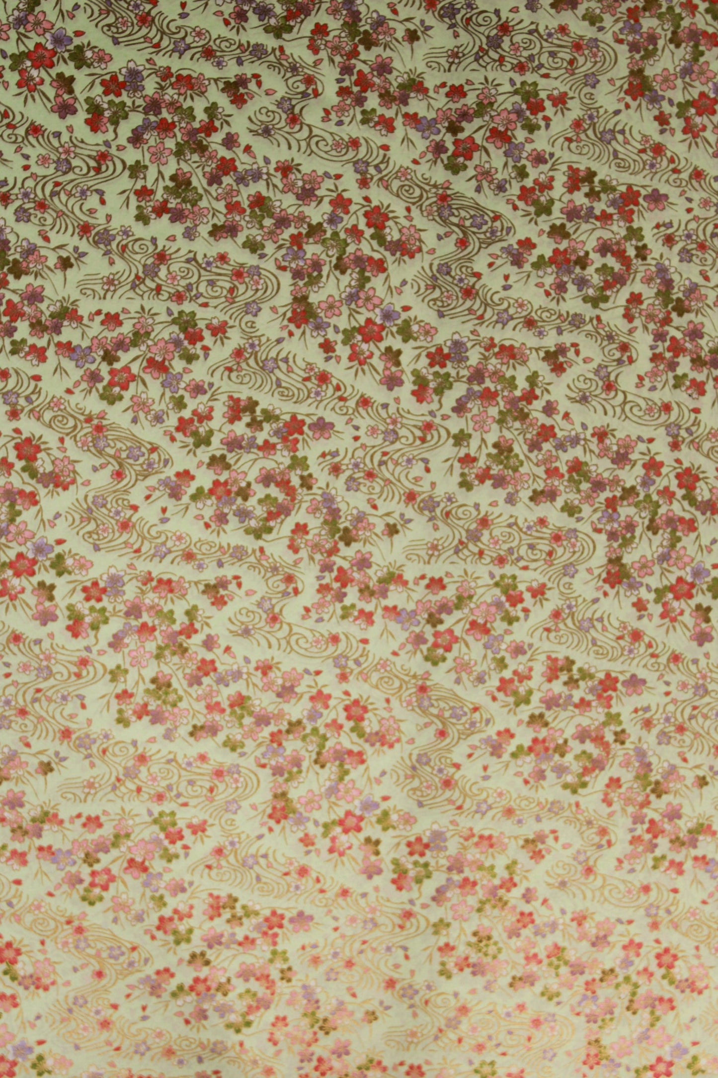 Floral patterned chiyogami paper  with small flowers and intricate designs on a beige background