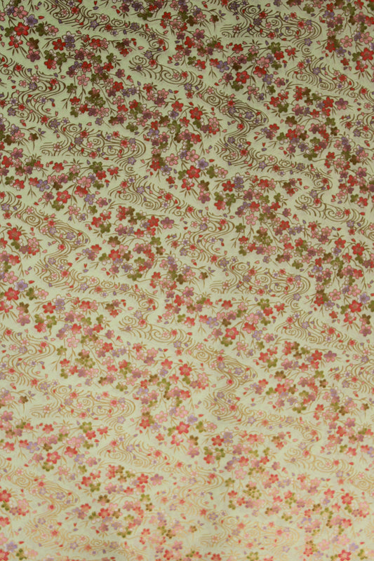 Floral patterned chiyogami paper  with small flowers and intricate designs on a beige background